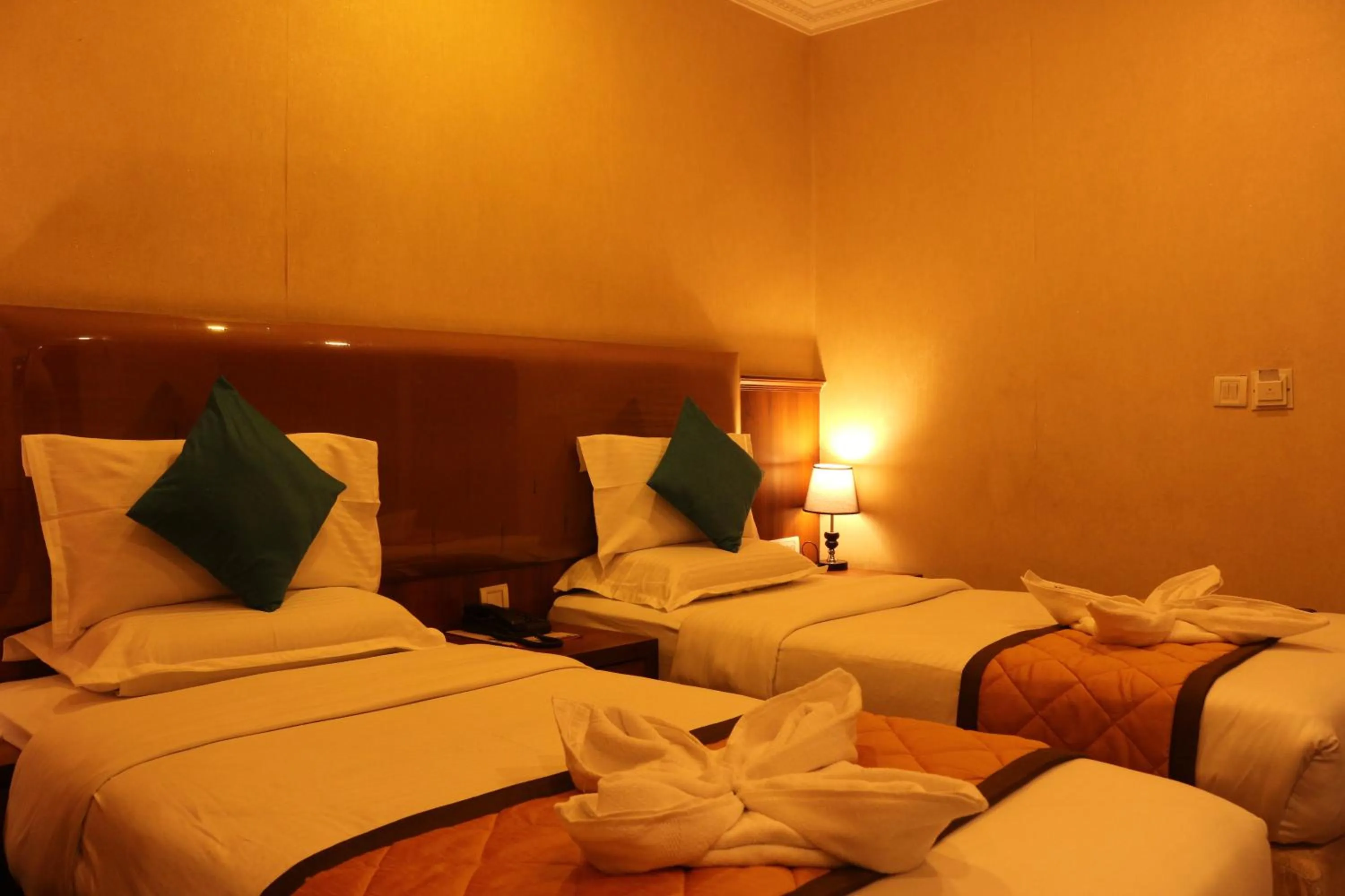 Bed in Hotel Noor Empire International Kormangala