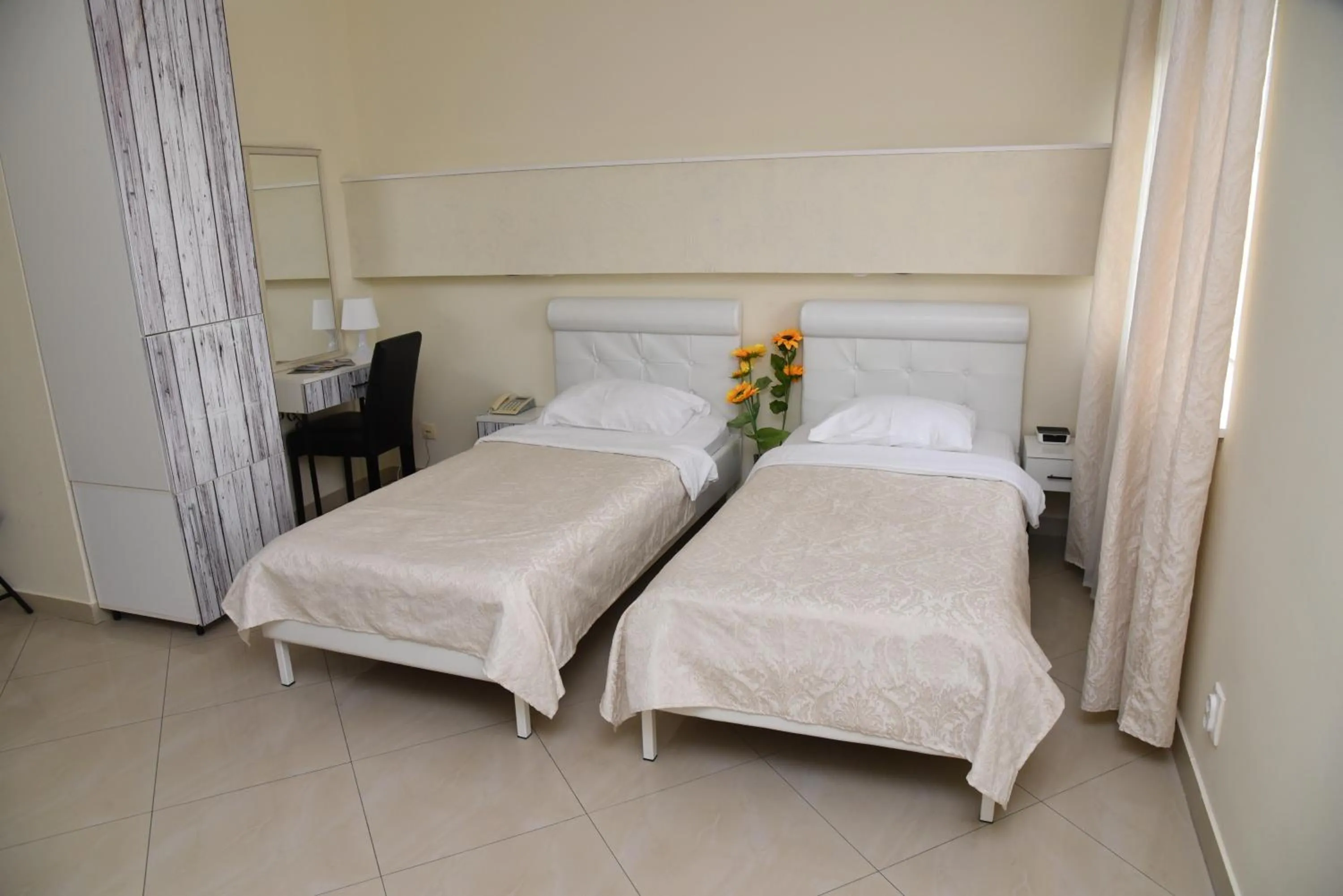 Bed in Garni Hotel Dash