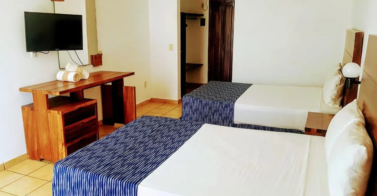 Bed in Costa Alegre Hotel & Suites