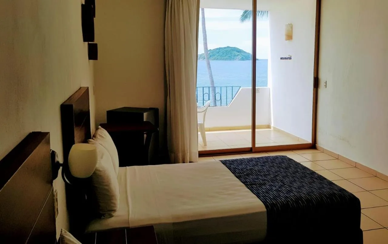 Bed in Costa Alegre Hotel & Suites