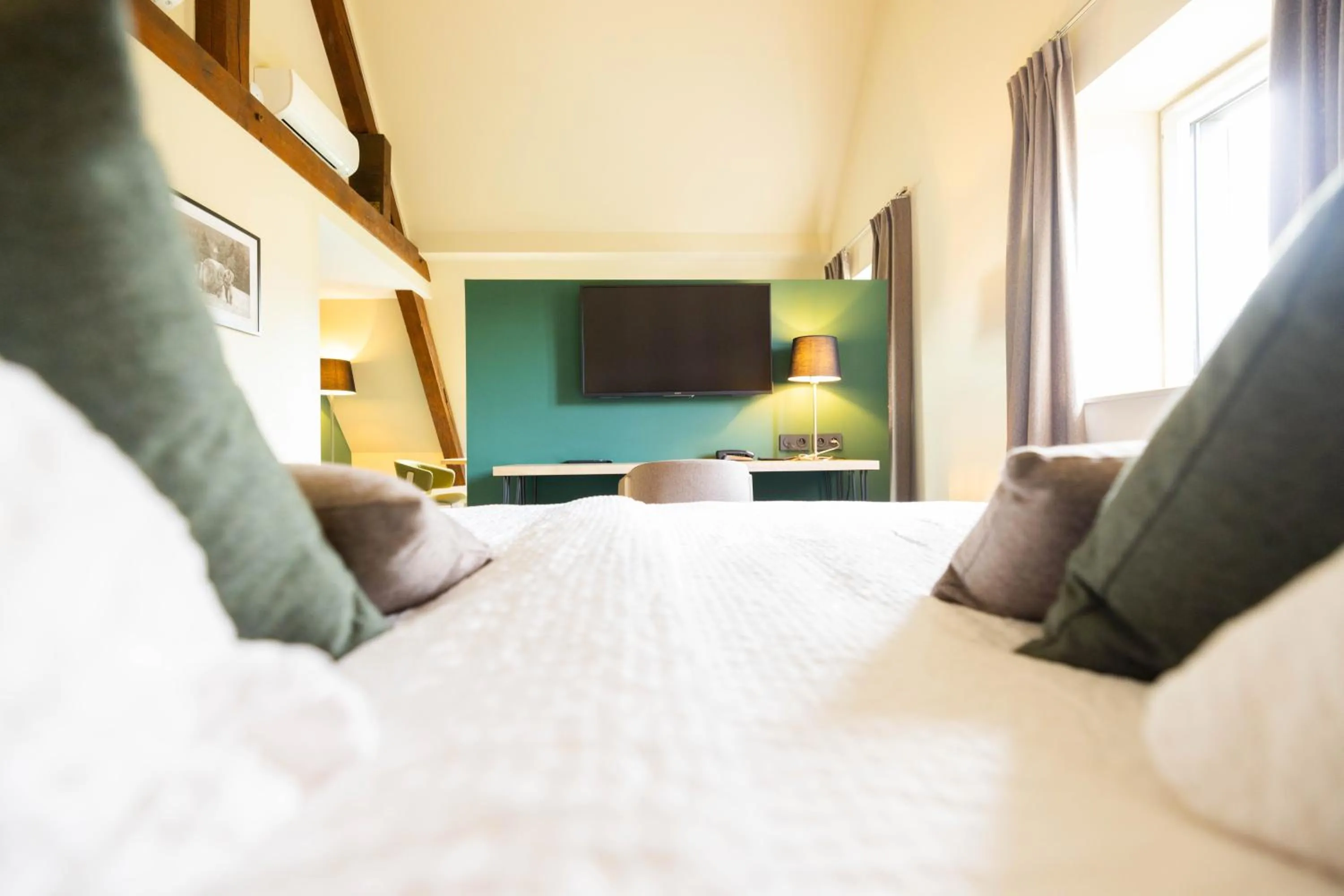 Bed in Logis Hôtel Restaurant & Spa La Rochette