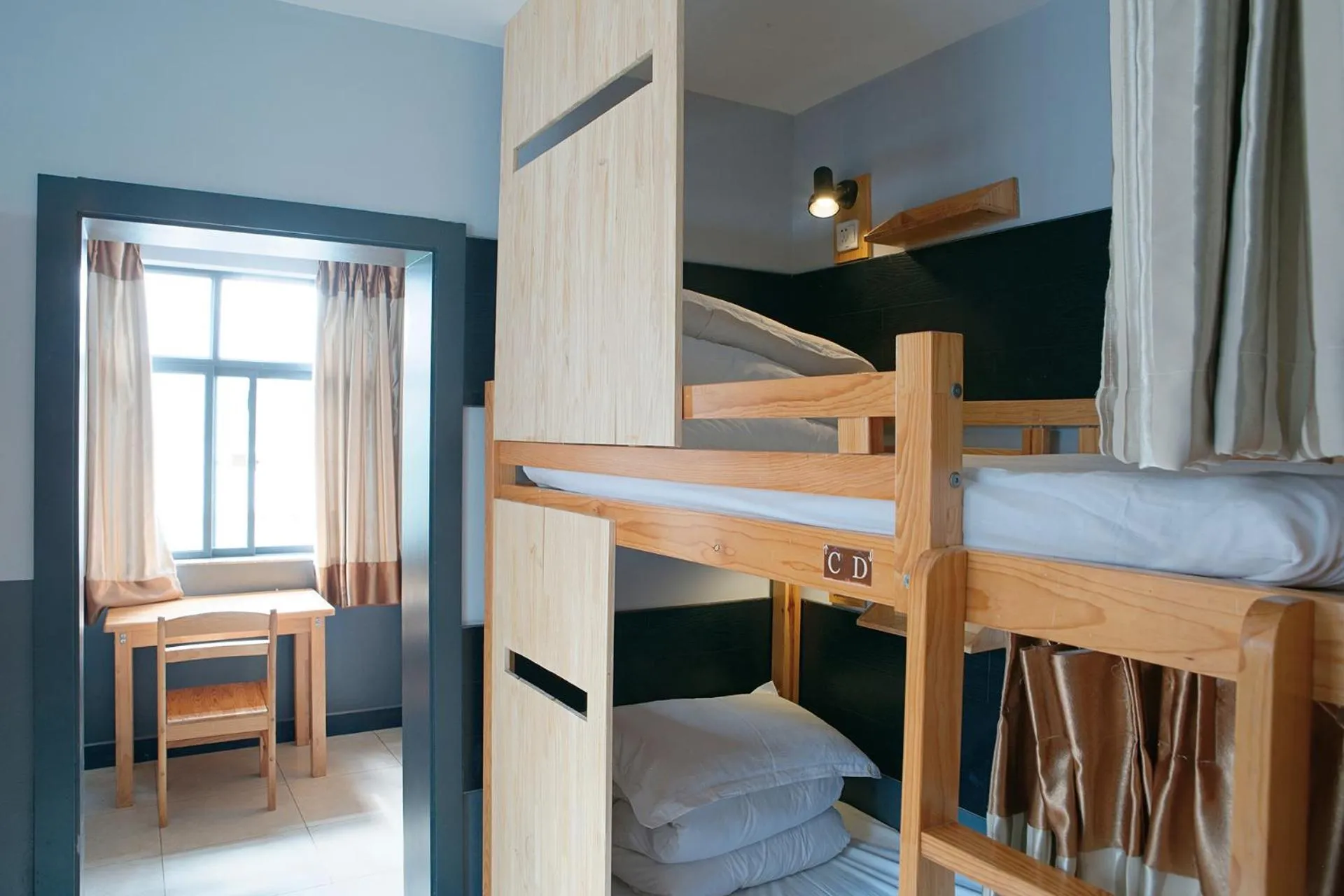 Photo of the whole room, Bed in Kunming Upland International Youth Hostel near the city center ,2 mins walk to the subway, 2 mins walk to the Green Lake, Close to Yuan tong Temple, Old street, Yunnan University, English-speaking service convenient payment and visa cards are accepted