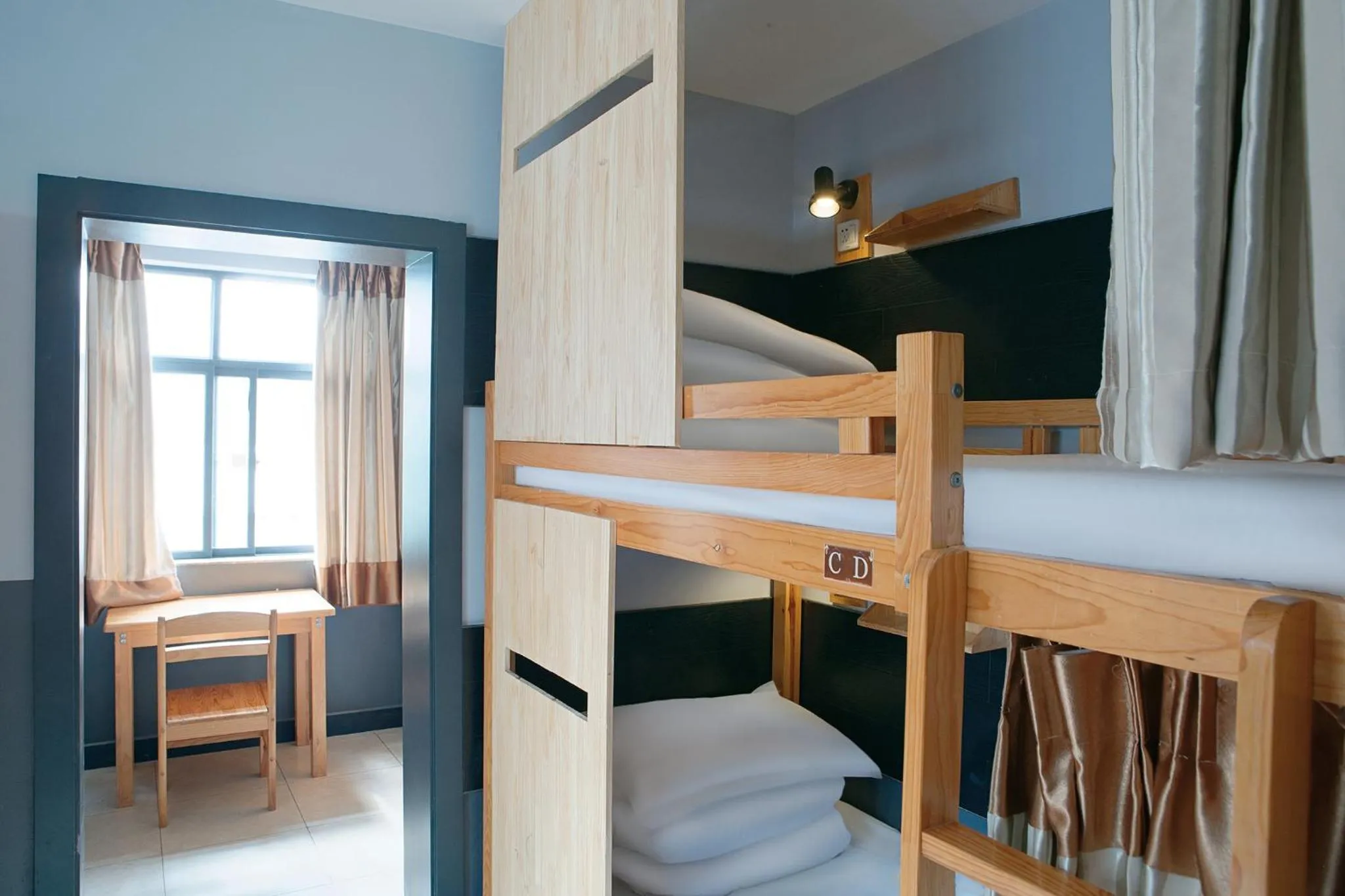 Photo of the whole room, Bed in Kunming Upland International Youth Hostel near the city center ,2 mins walk to the subway, 2 mins walk to the Green Lake, Close to Yuan tong Temple, Old street, Yunnan University, English-speaking service convenient payment and visa cards are accepted
