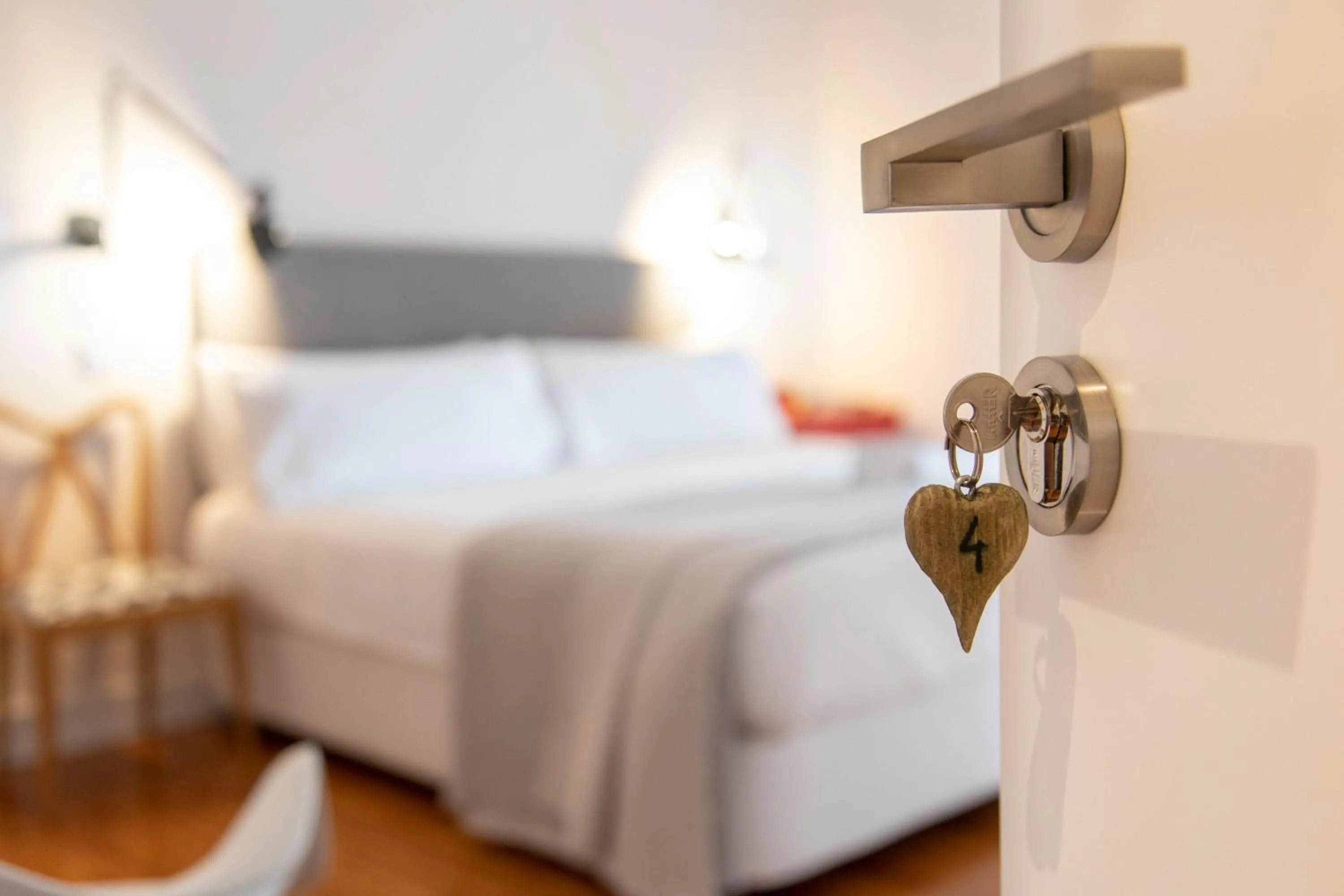 Bed in SANMARTINA HOTEL