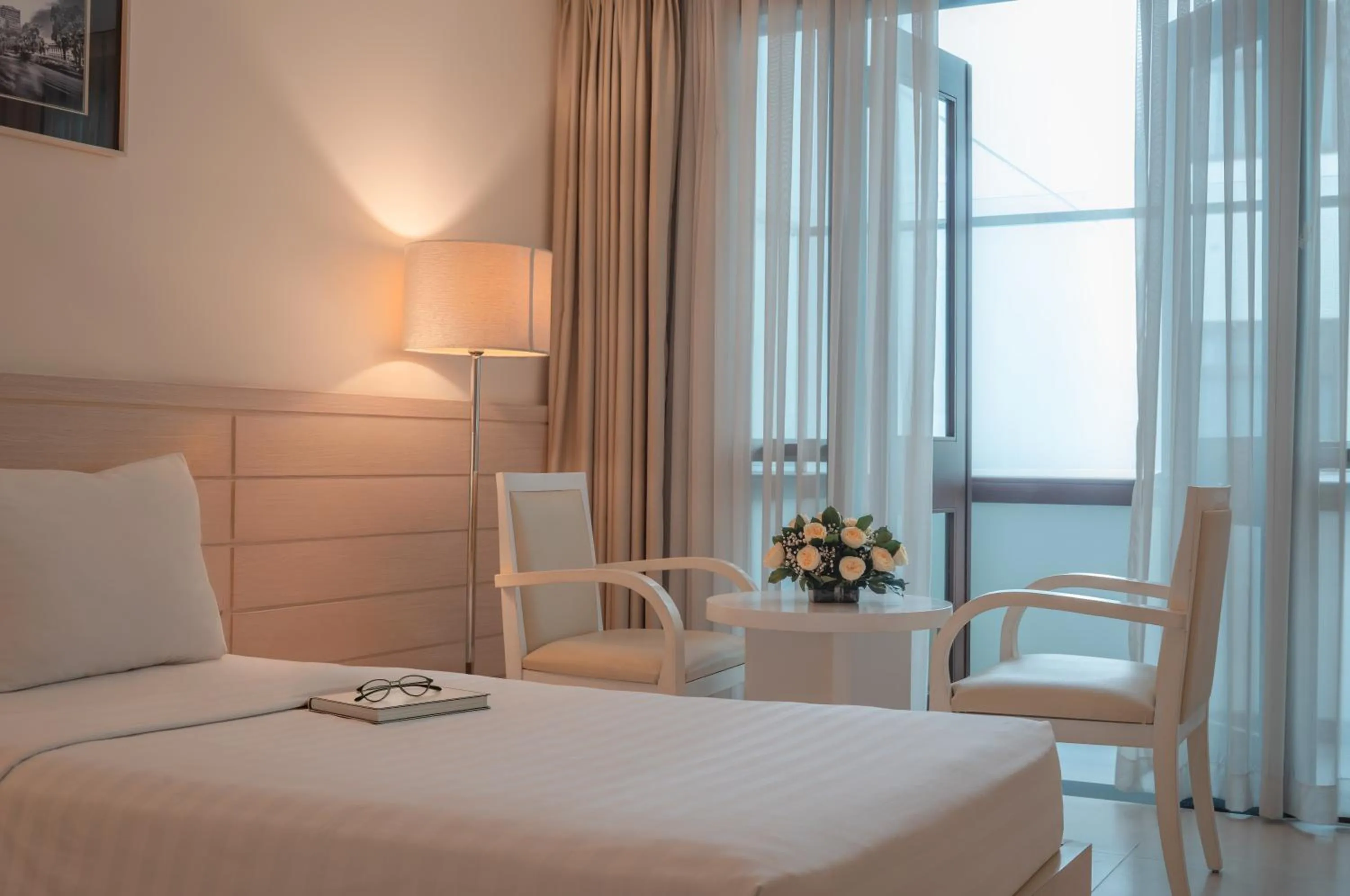 Seating area, Bed in Nhi Phi Hotel