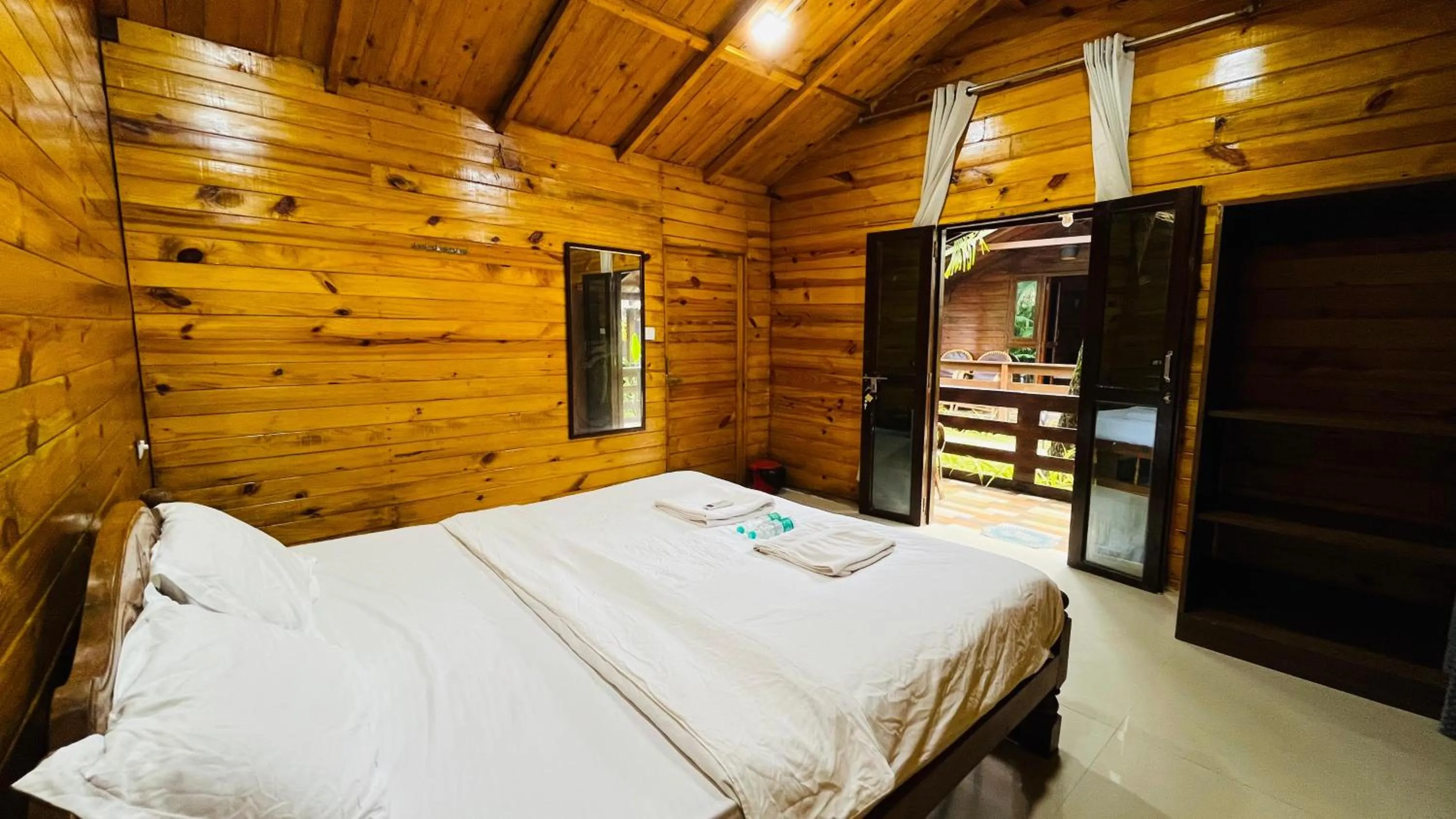 Bed in Palolem Luxuries Beach Cottages