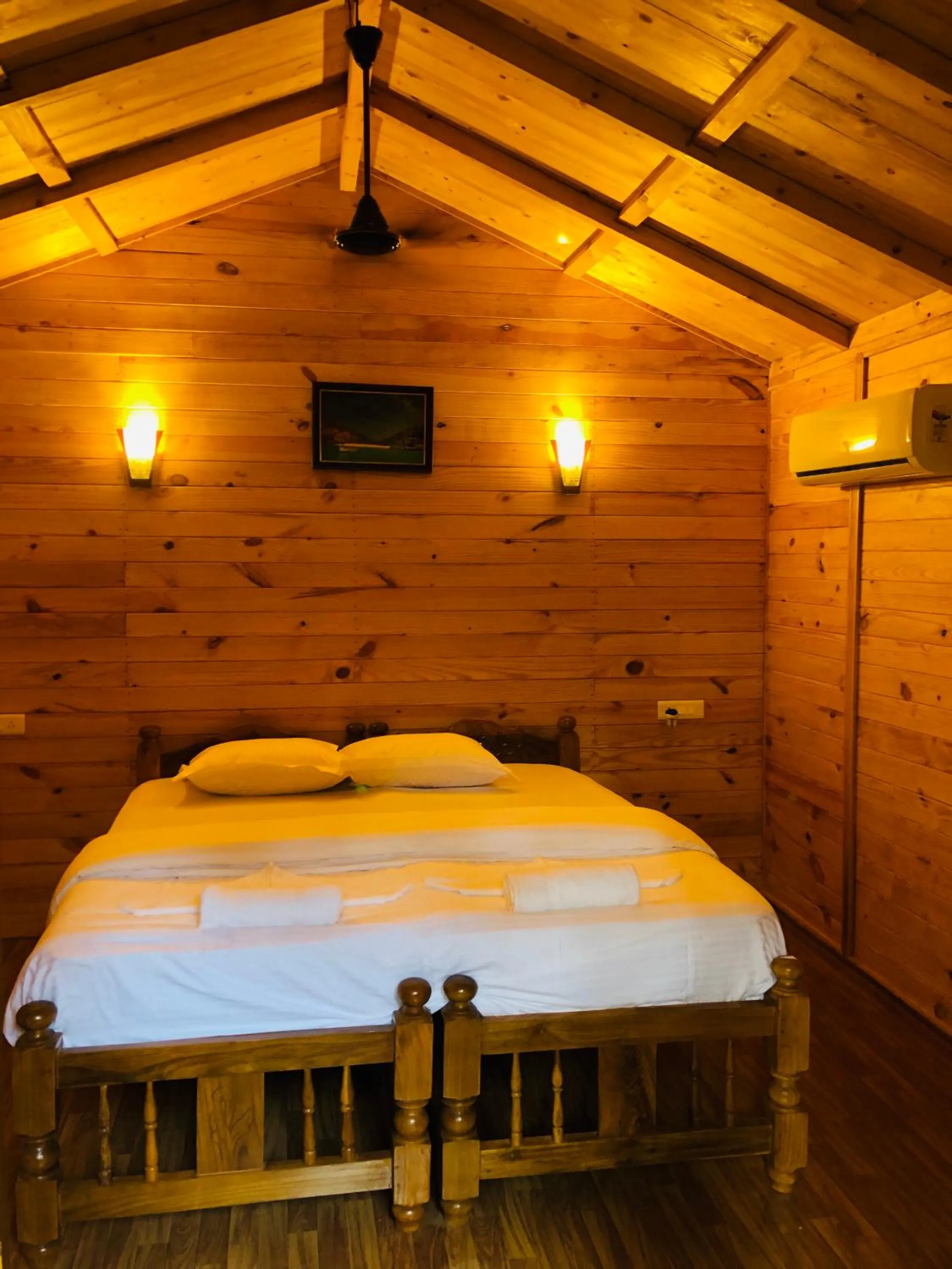 Bed in Palolem Luxuries Beach Cottages