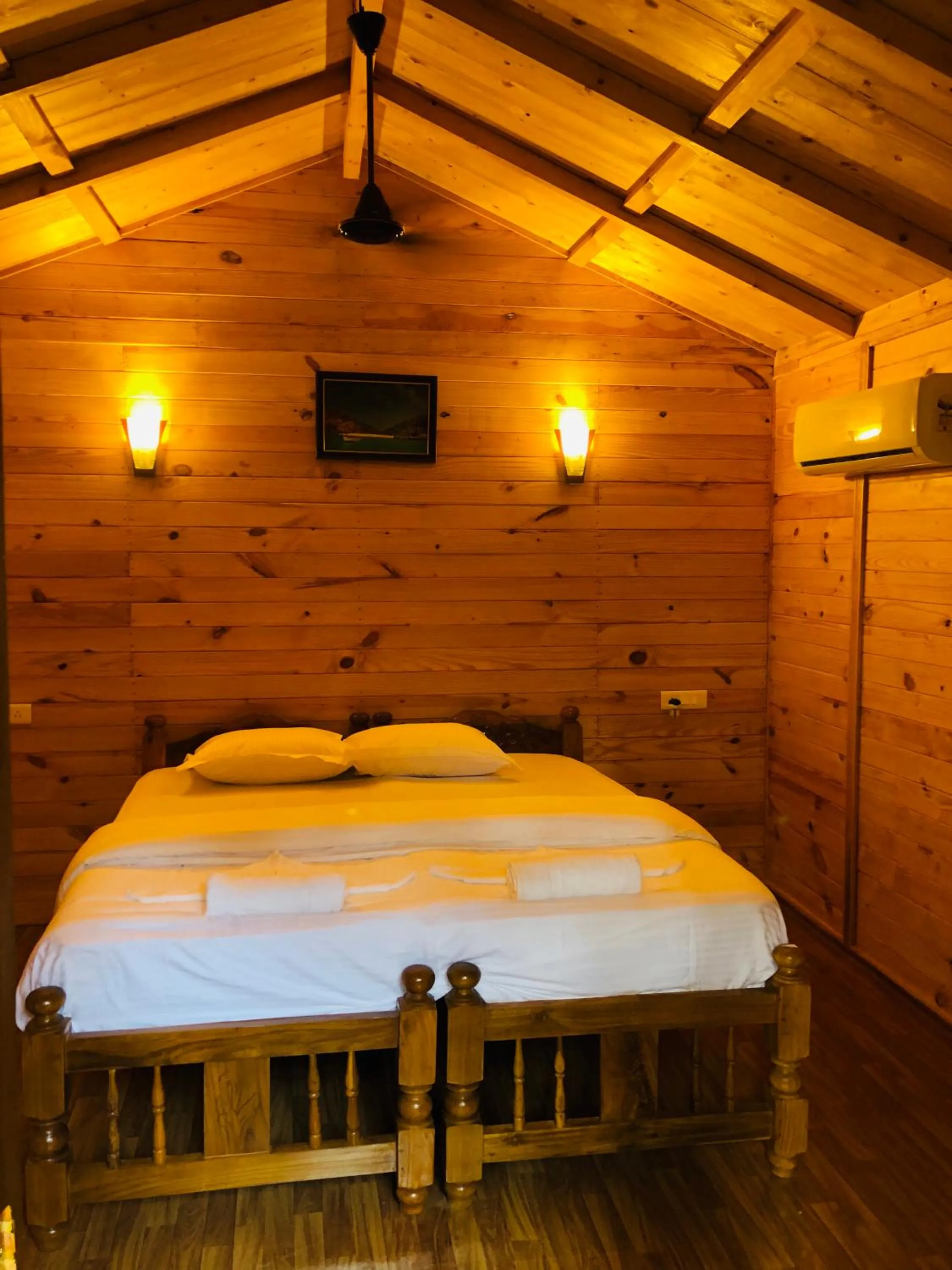 Bed in Palolem Luxuries Beach Cottages