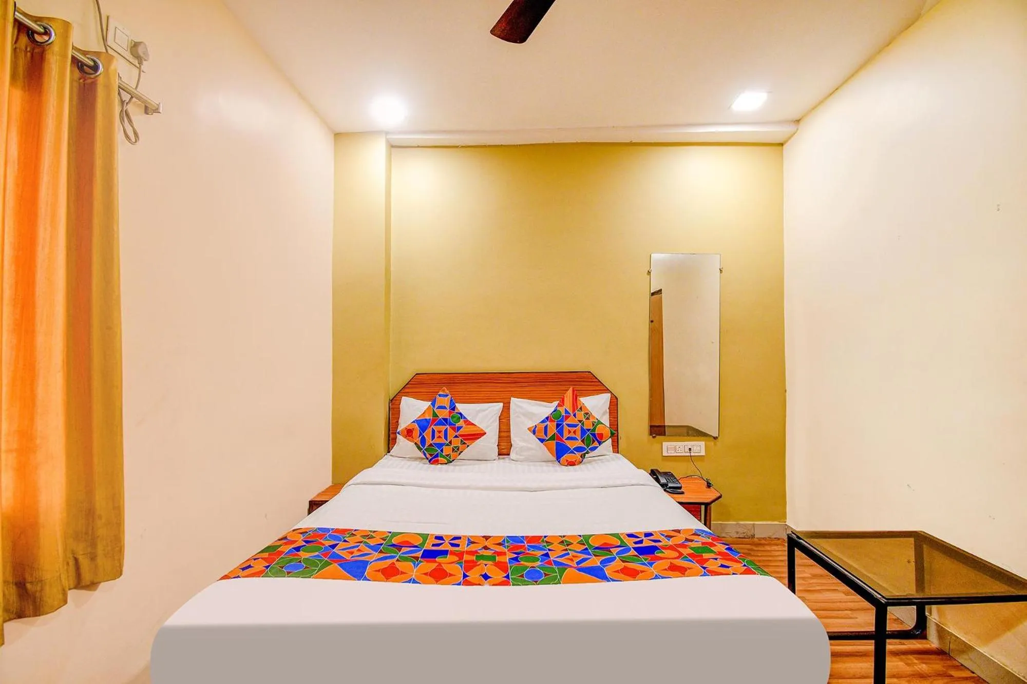 Bed in FabHotel Kamala Inn