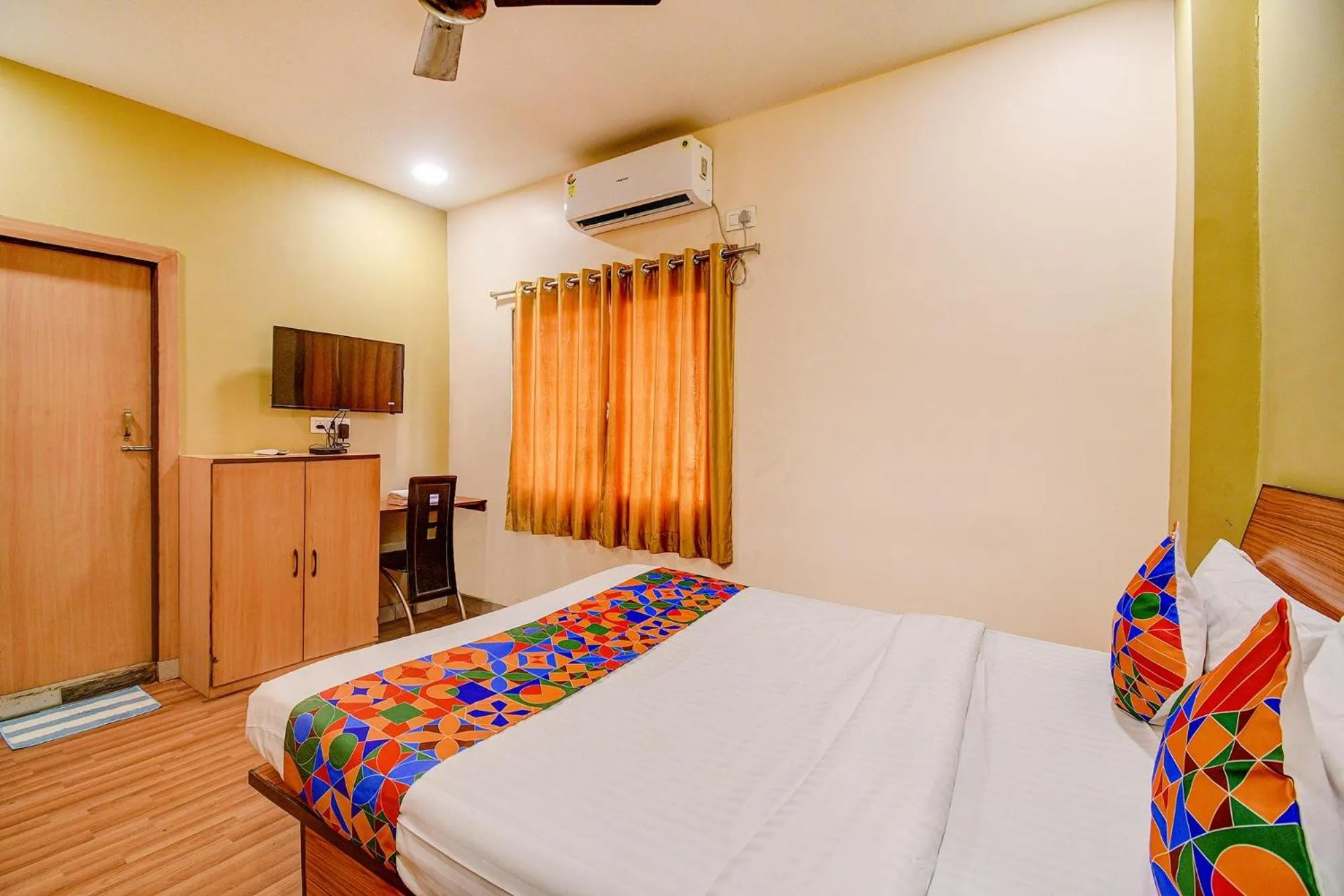 Bed in FabHotel Kamala Inn