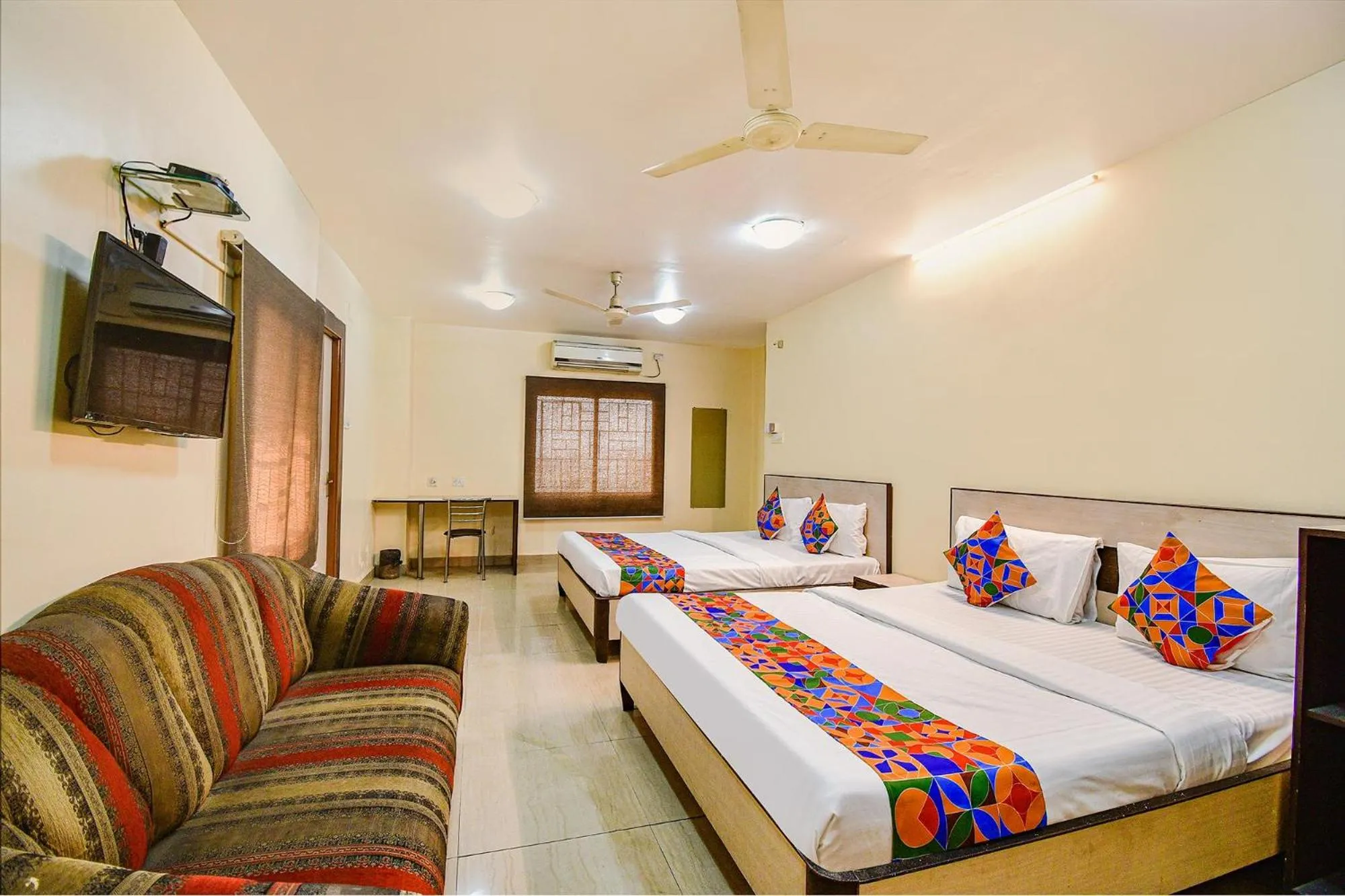 Bed in FabHotel Kamala Inn