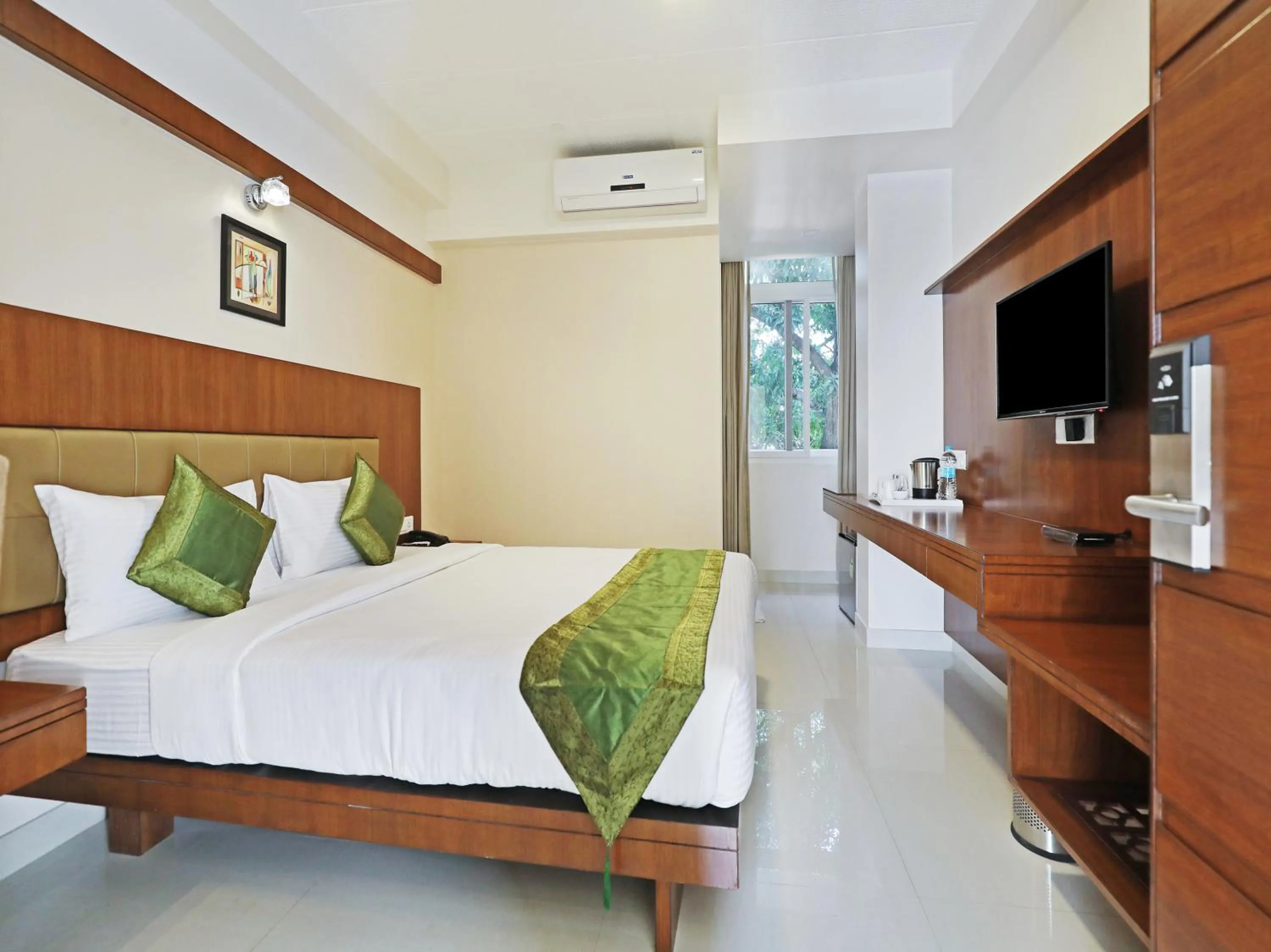 Bed in Treebo Akshaya Bull Temple