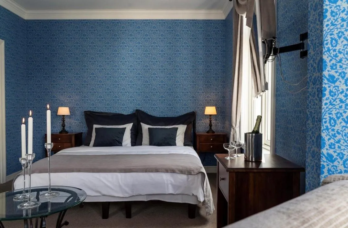 Photo of the whole room, Bed in Grand Hotel Flekkefjord