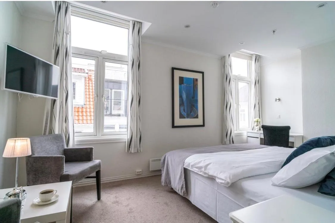 Photo of the whole room, Bed in Grand Hotel Flekkefjord