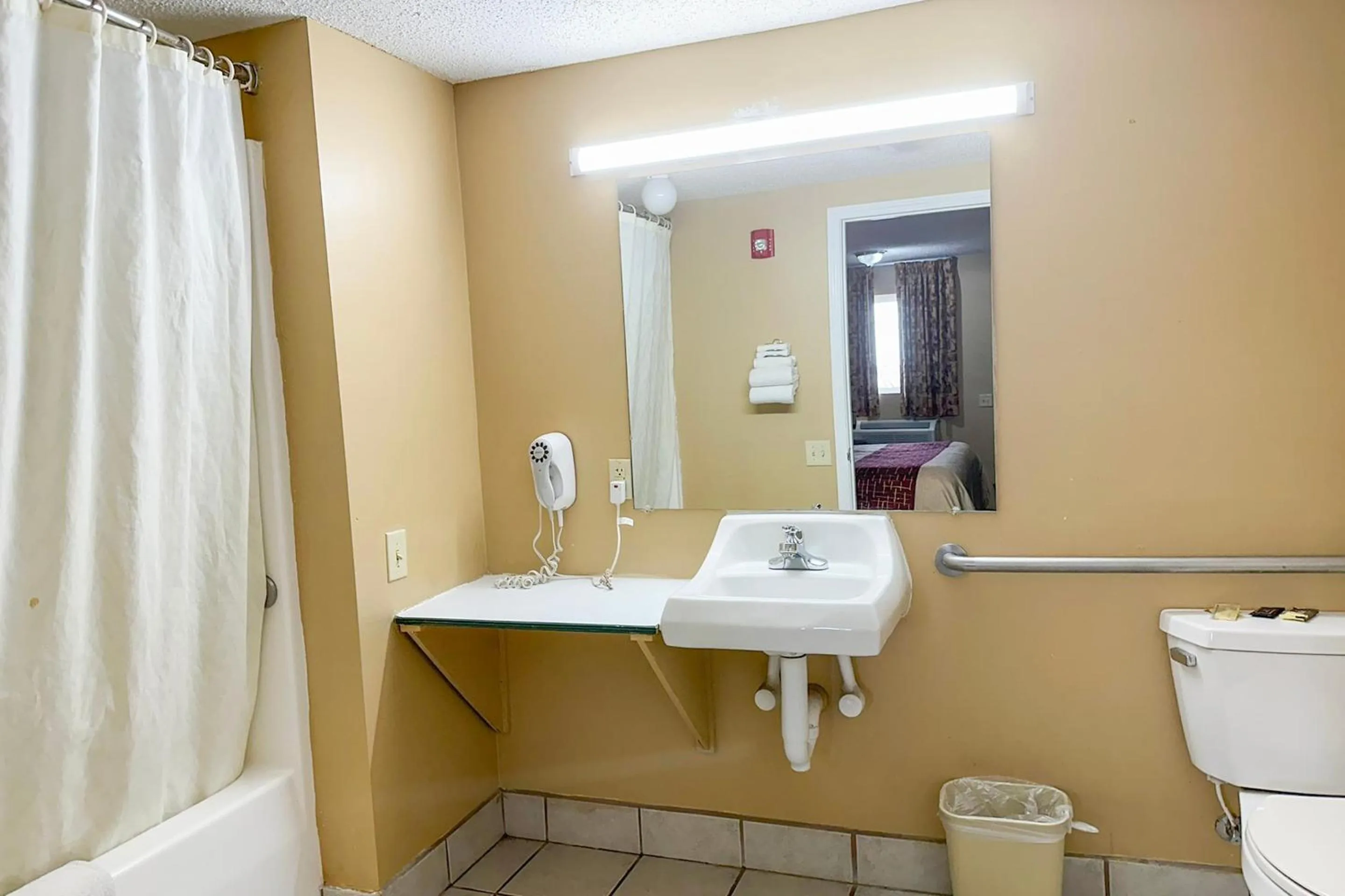 Bathroom in Garden Inn & Suites