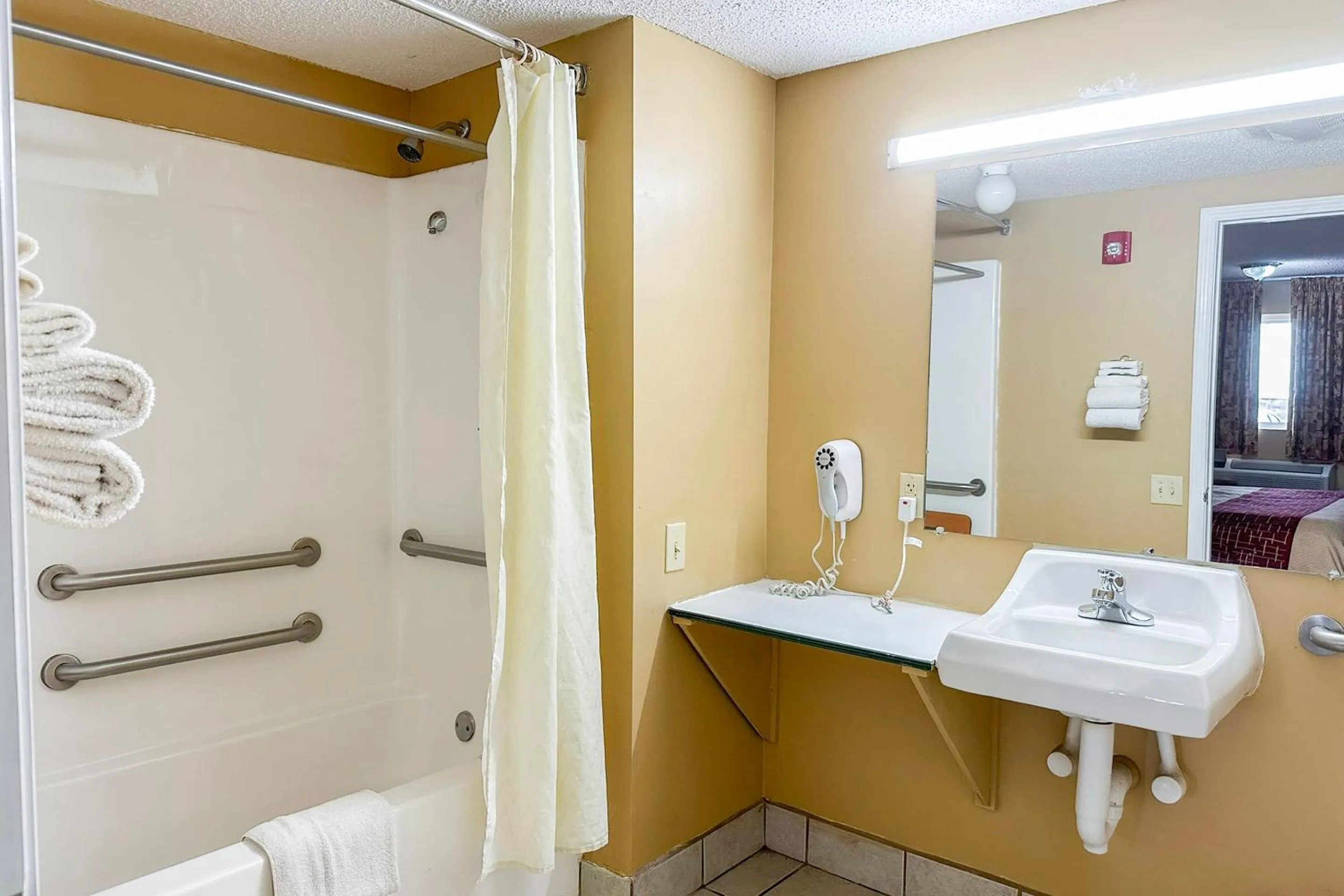 Bathroom in Garden Inn & Suites