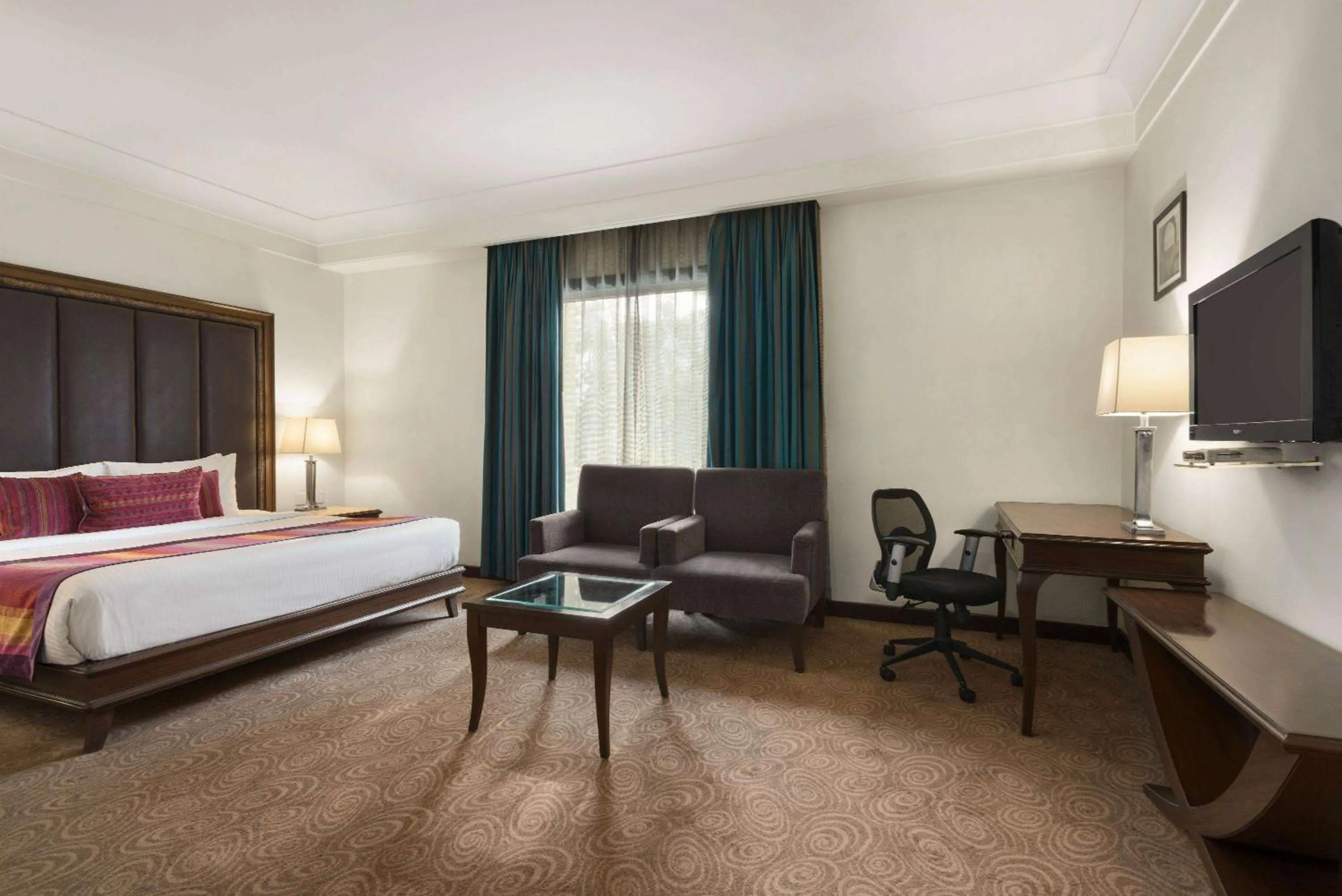 Photo of the whole room, Bed in Ramada by Wyndham Jalandhar City Center