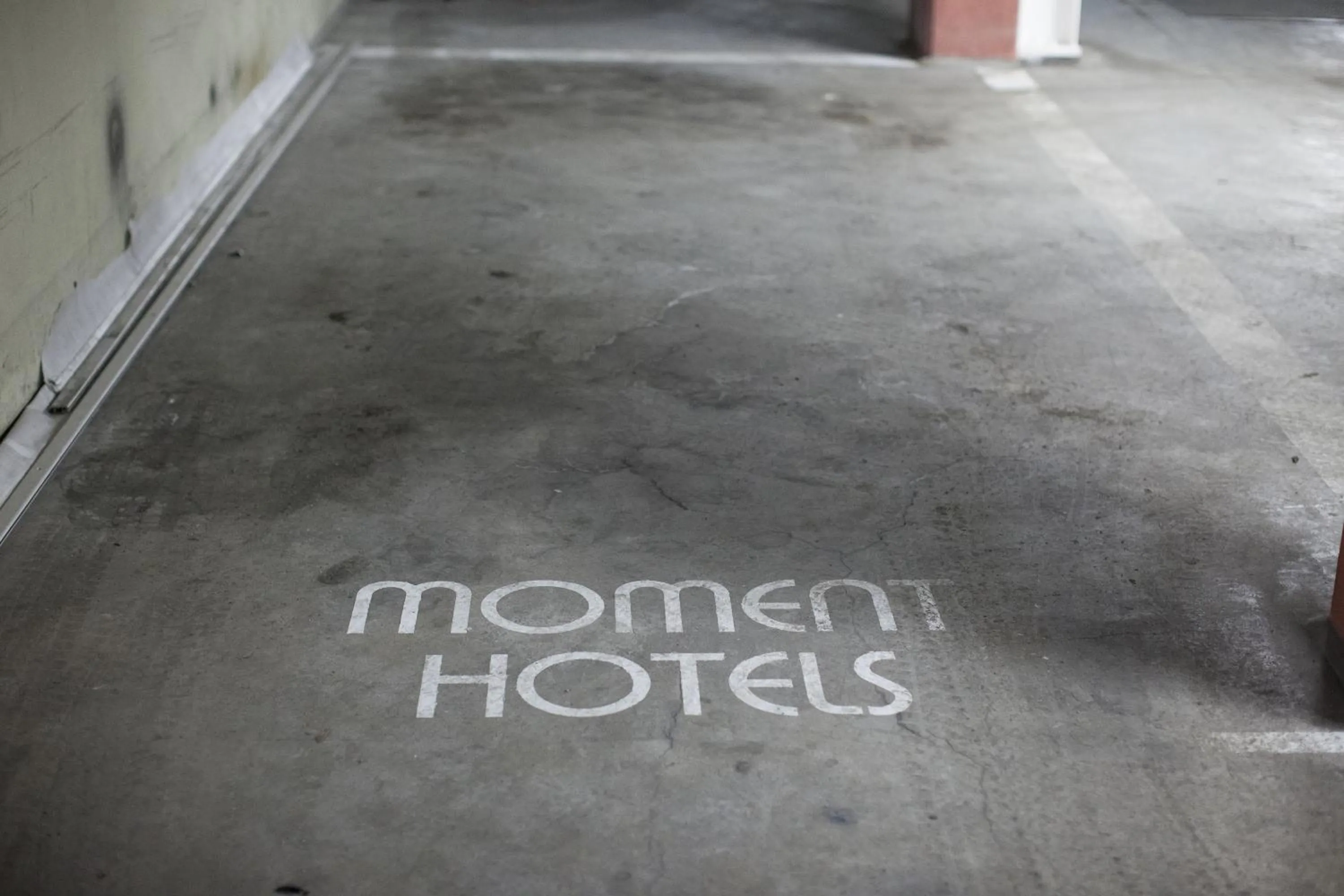Property logo or sign in Moment Hotels