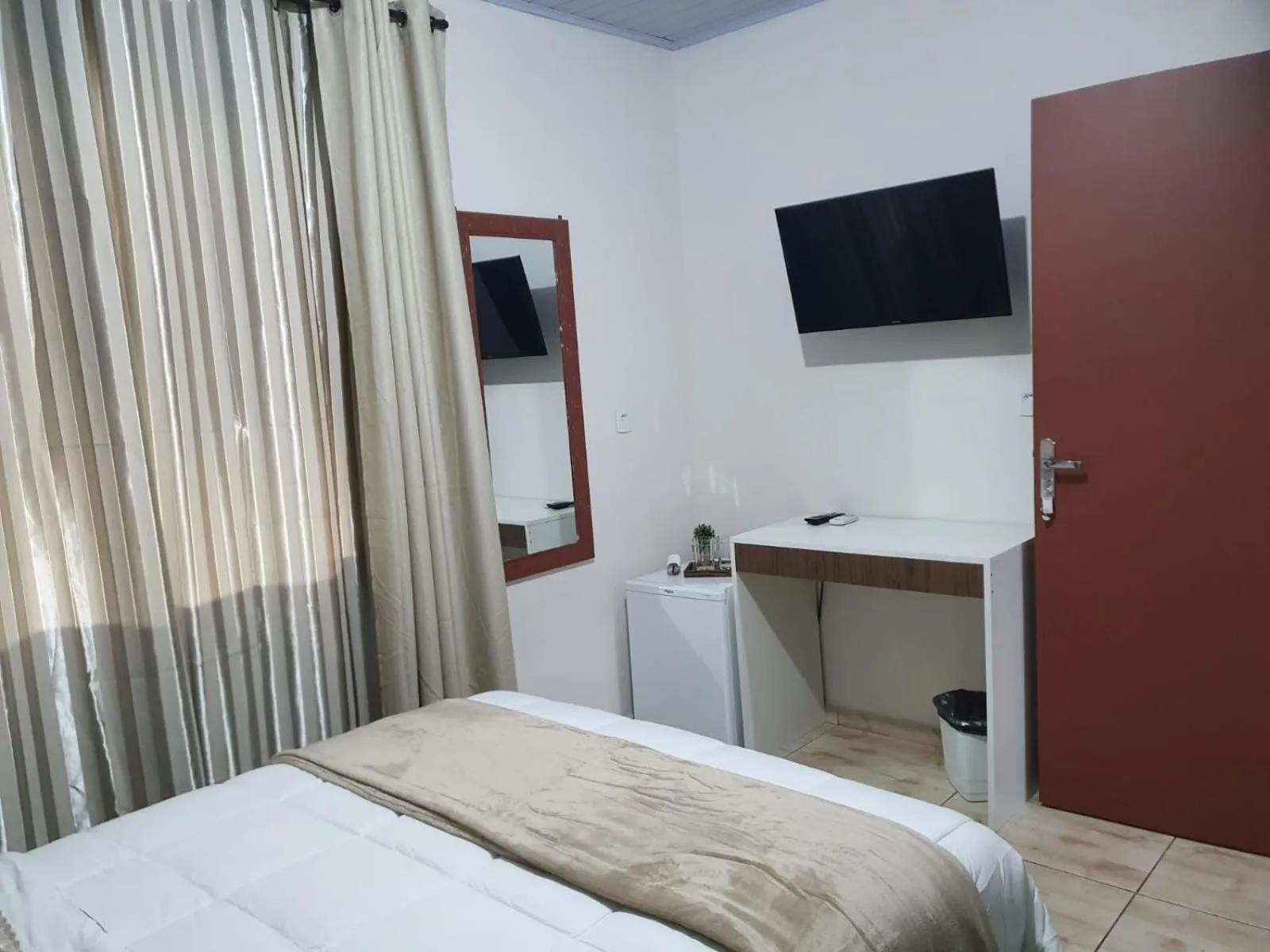 Bed in Pousada Família Cordeiro