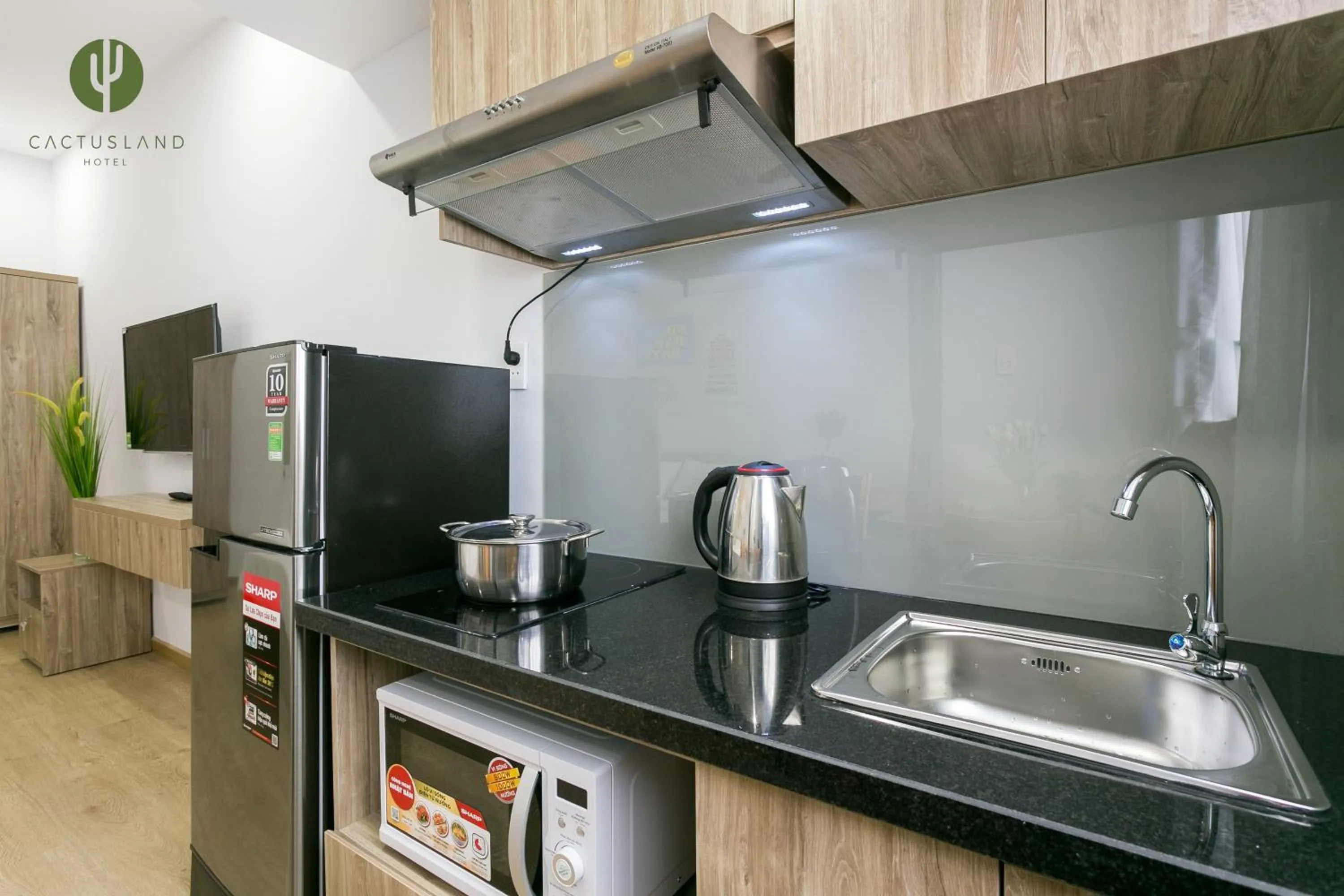 Kitchen or kitchenette in Cactusland Hotel & Apartment