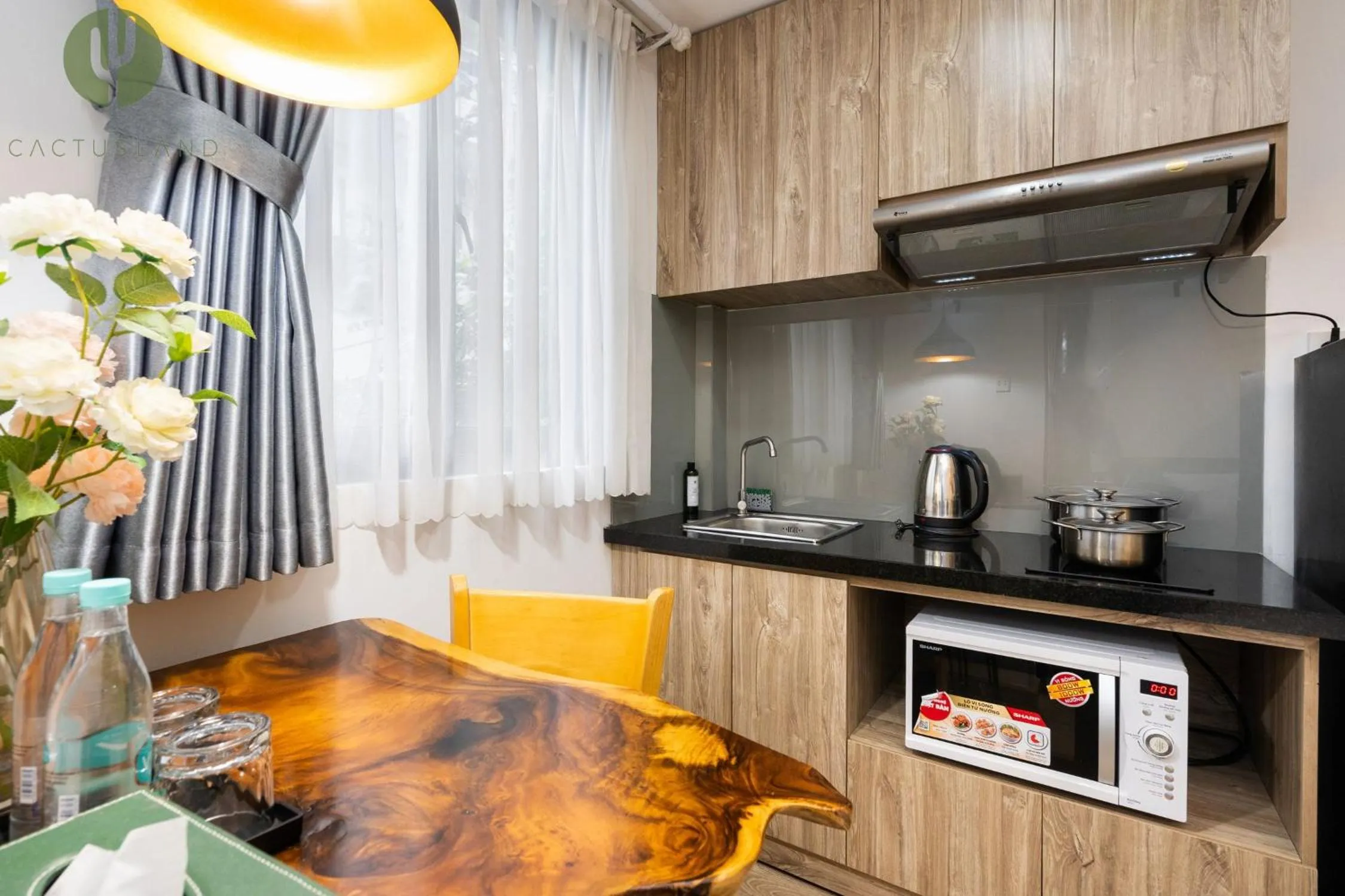 Kitchen or kitchenette in Cactusland Hotel & Apartment