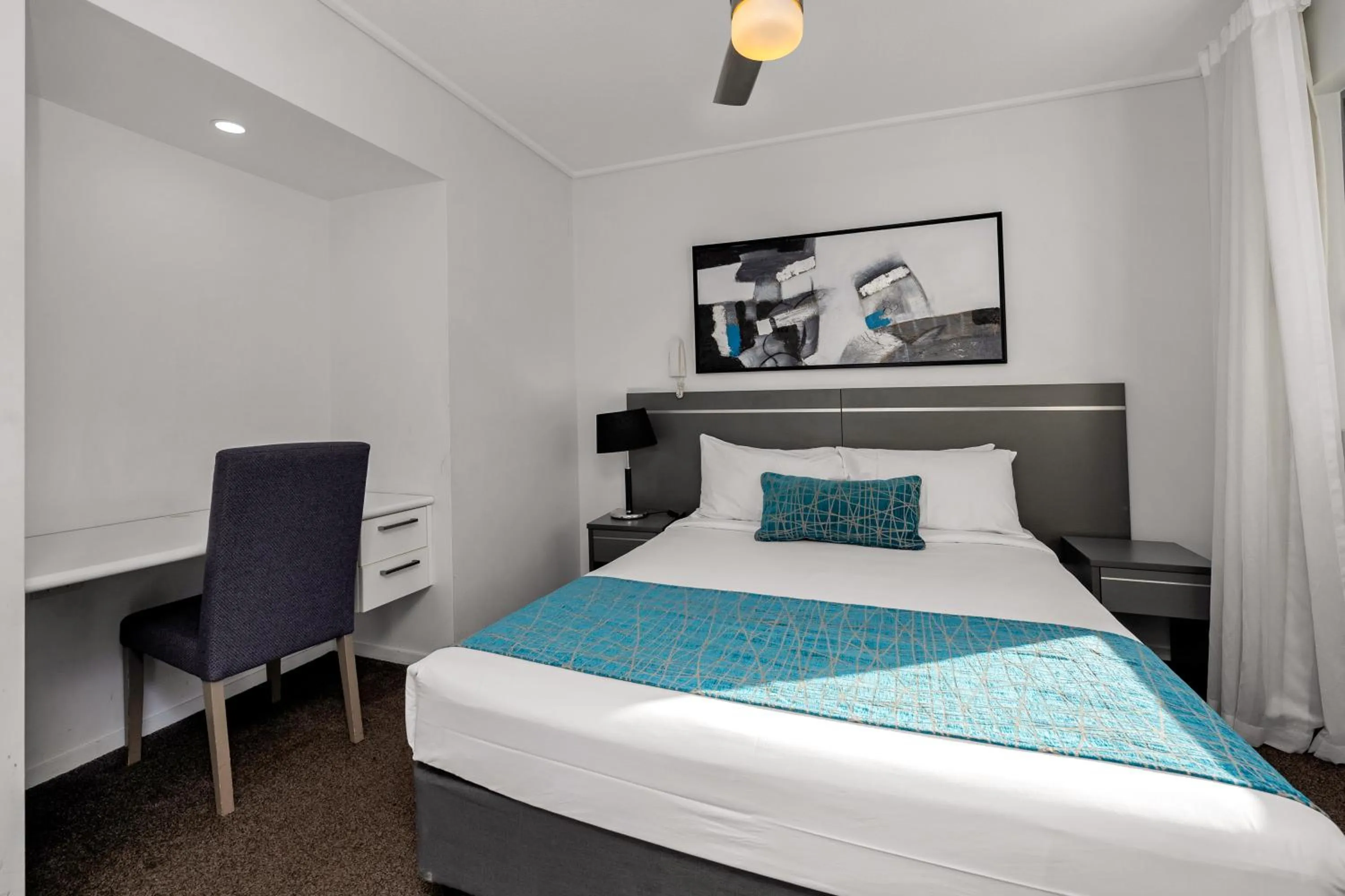 Bed in Central Kensington Apartments