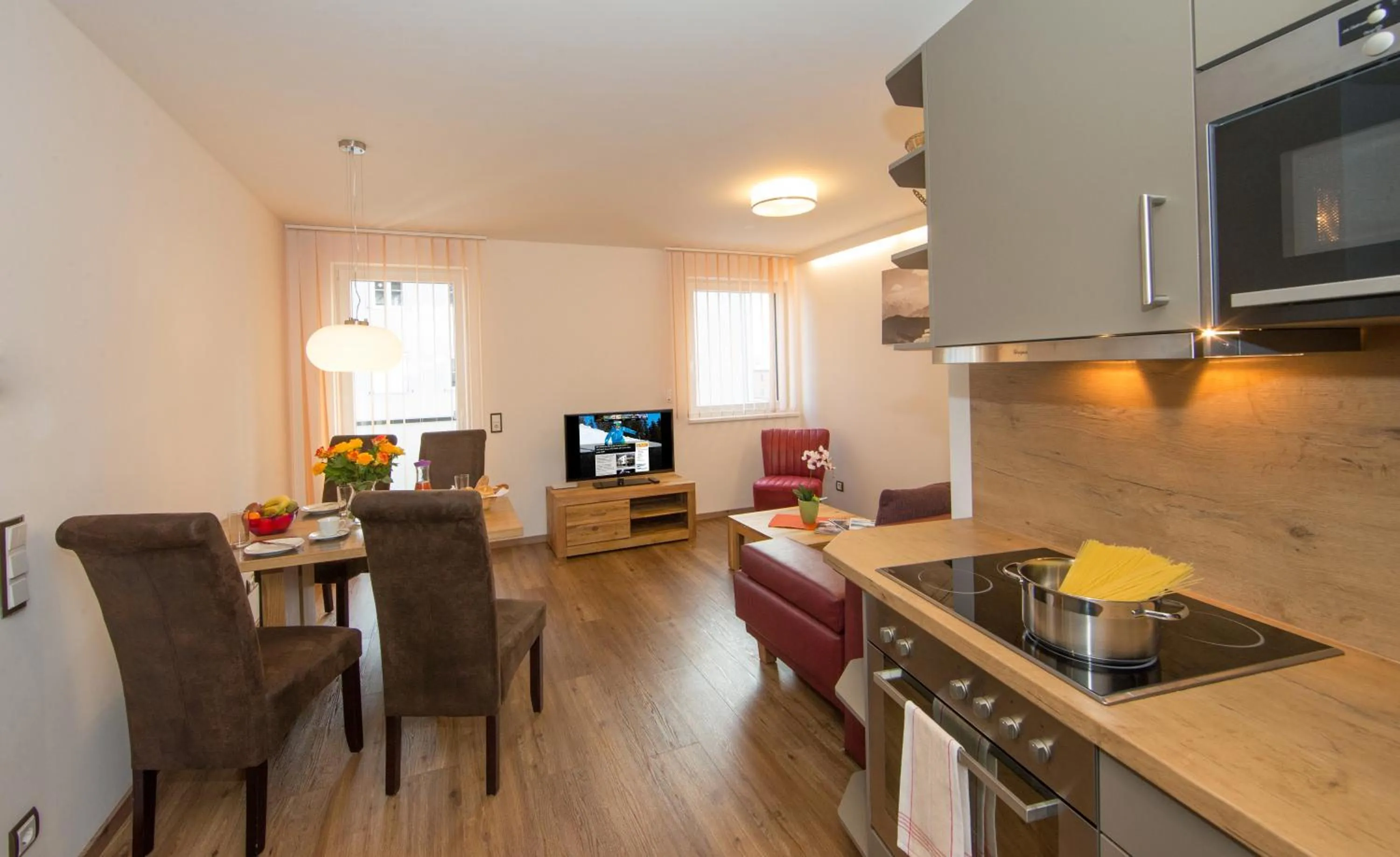 Kitchen or kitchenette in Appartement Living Schönwies apartments with private Infrared cabin and Zell am See Kaprun summercard
