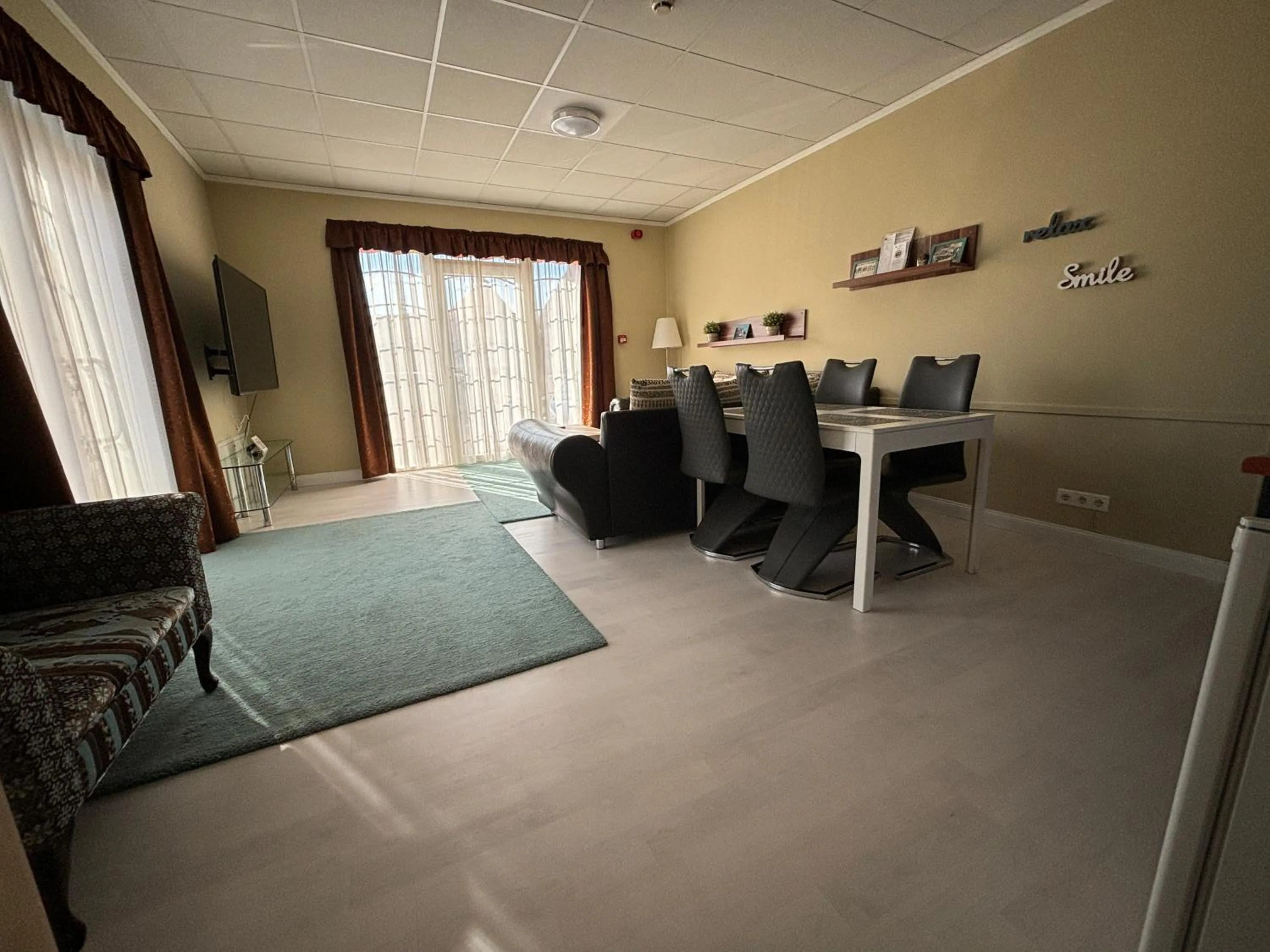 Living room, Bed in Libra Hotel