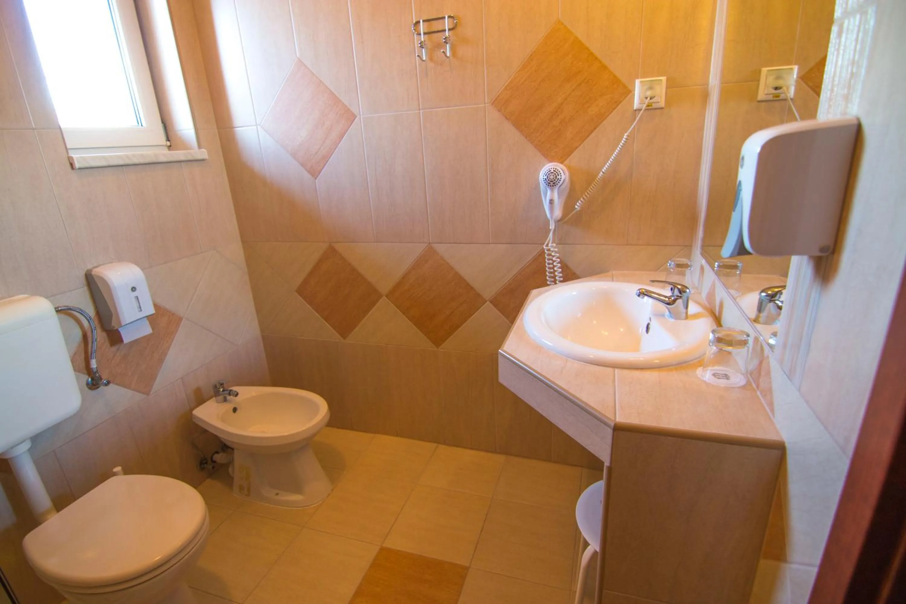 Toilet in Libra Hotel