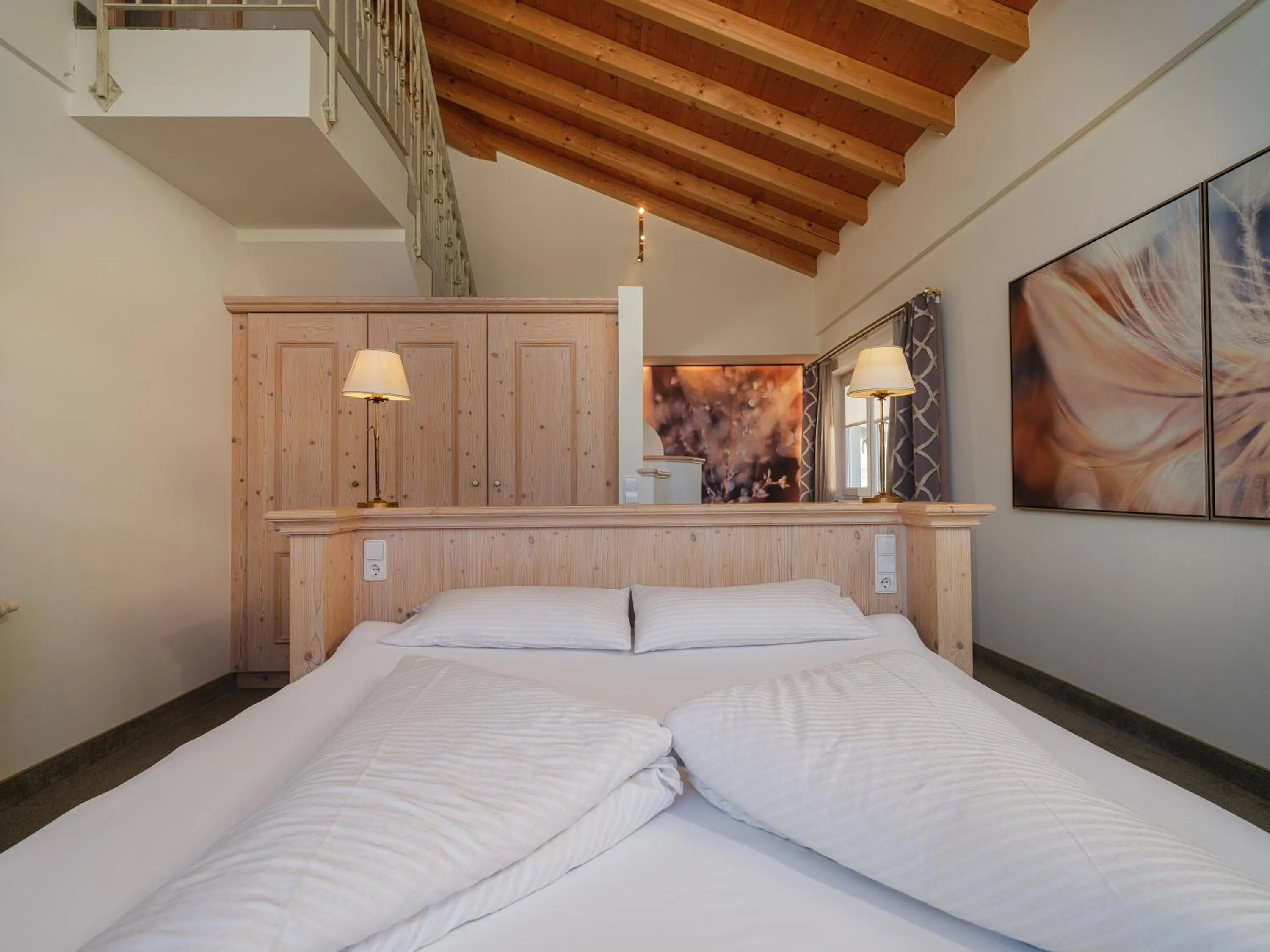 Bed in Hotel Alpina Wellness & Spa Resort
