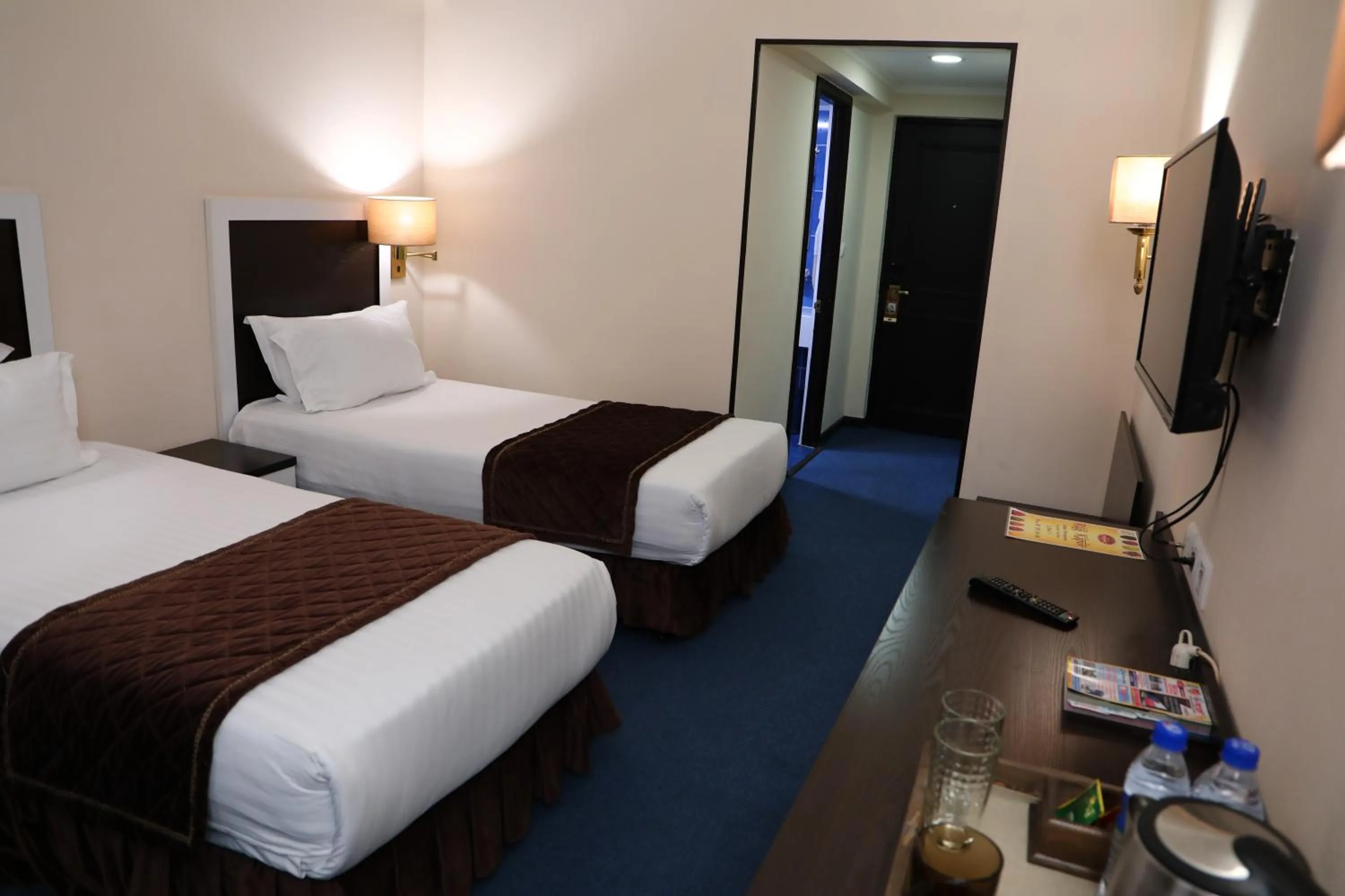 Bed in Le Grande Plaza Hotel