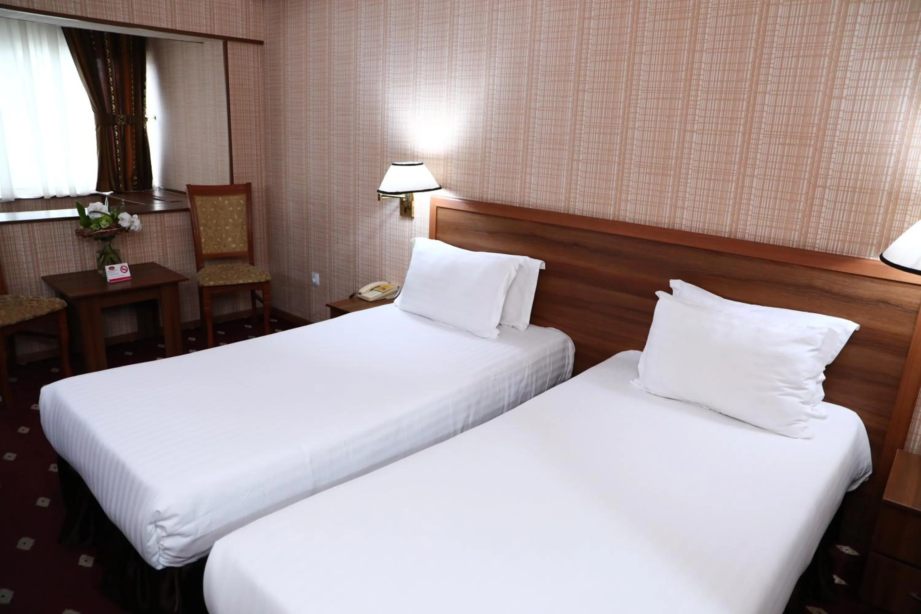 Bed in Le Grande Plaza Hotel