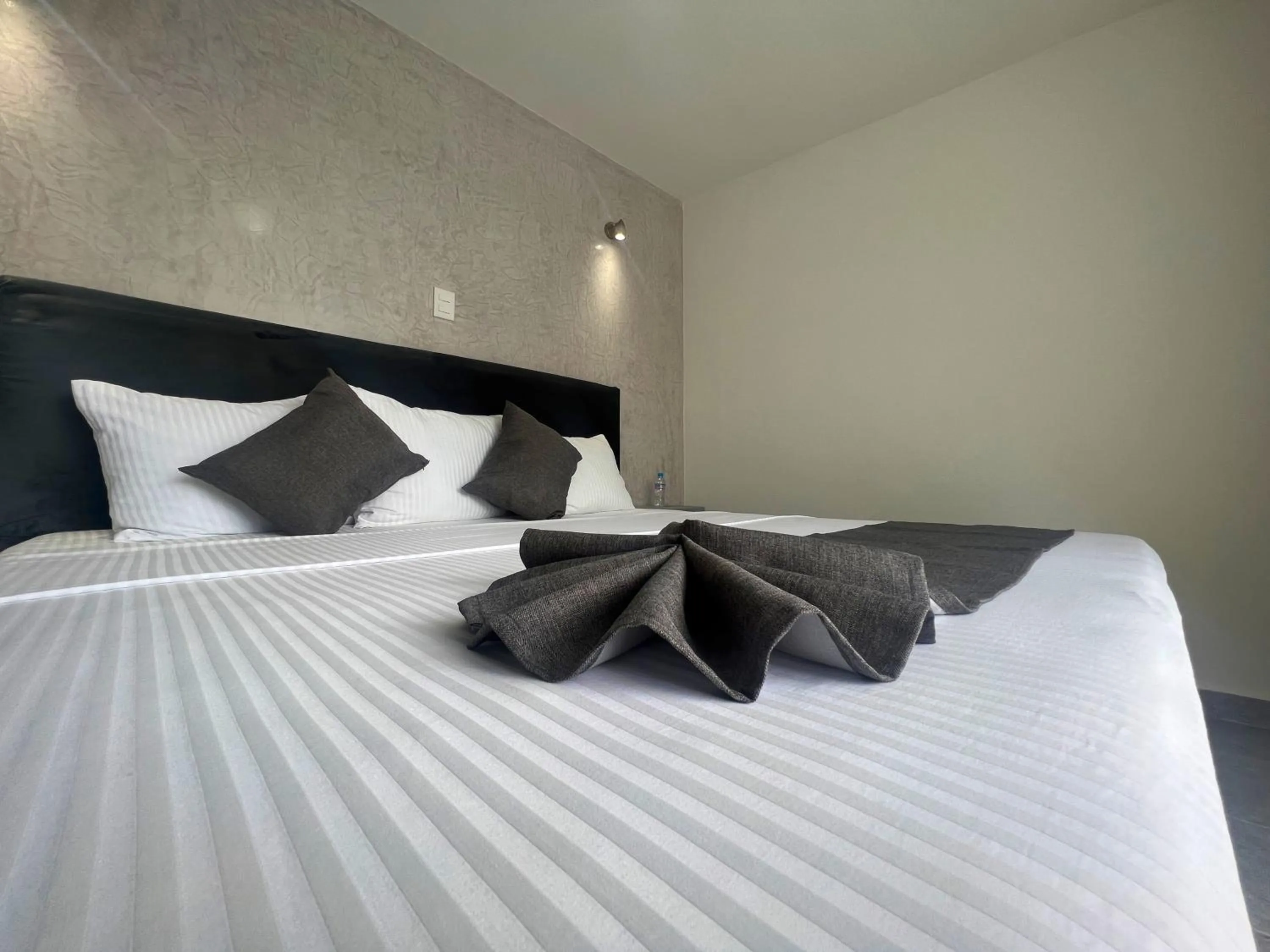 Bed in AOHOM SANTUARIO HOTEL & SPA