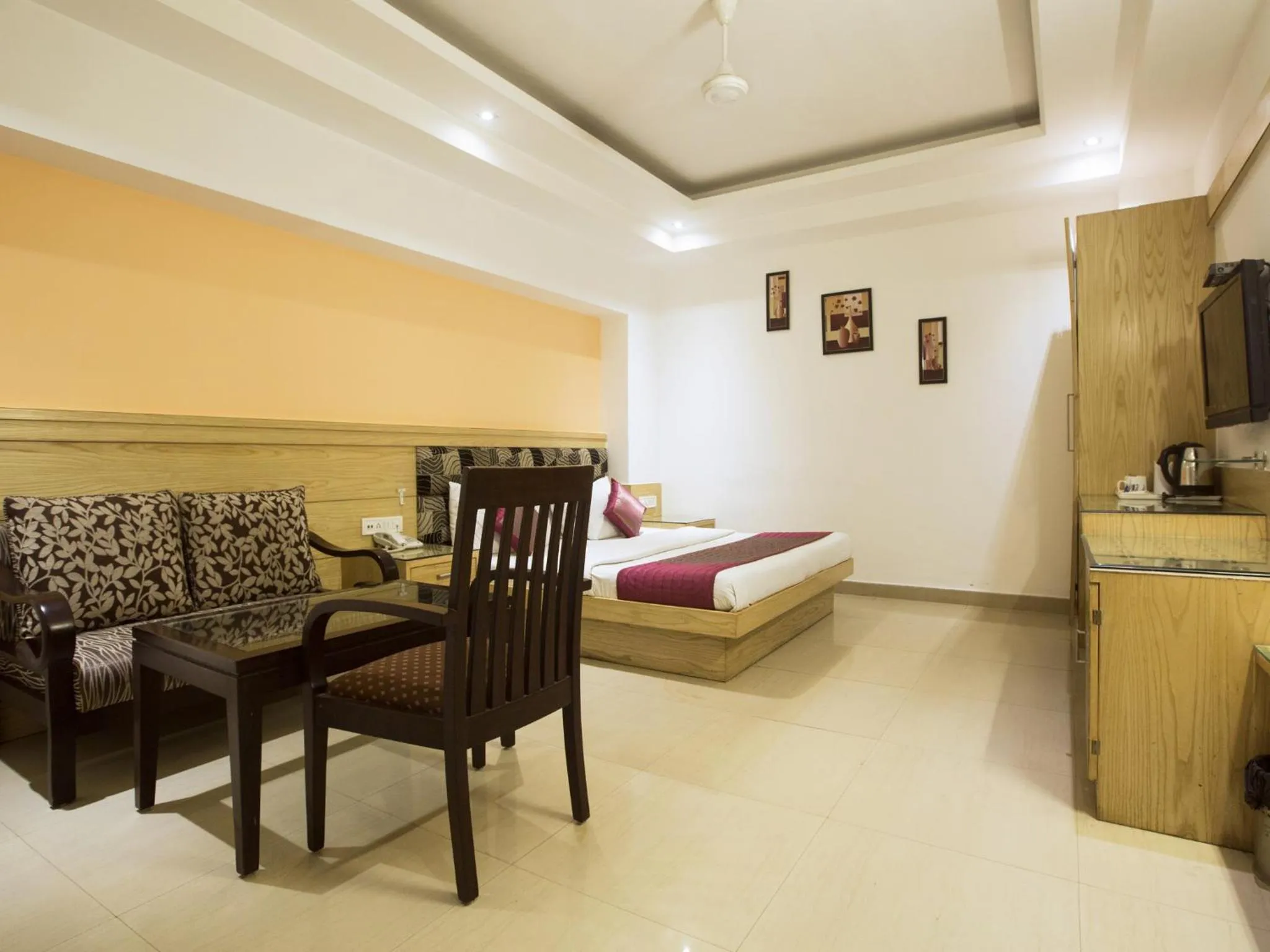 Seating area, Bed in Hotel Krishna Deluxe-By RCG Hotels