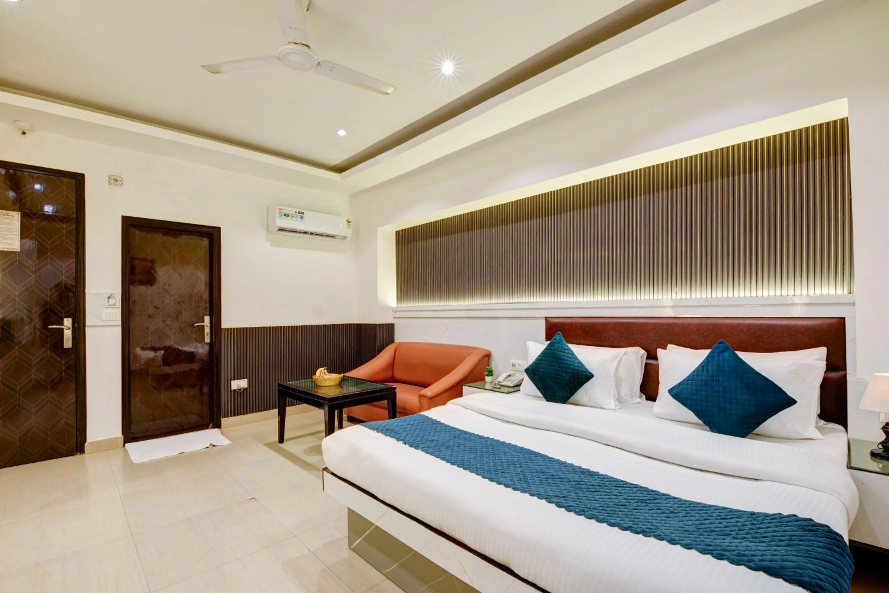 Seating area, Bed in Hotel Krishna Deluxe-By RCG Hotels