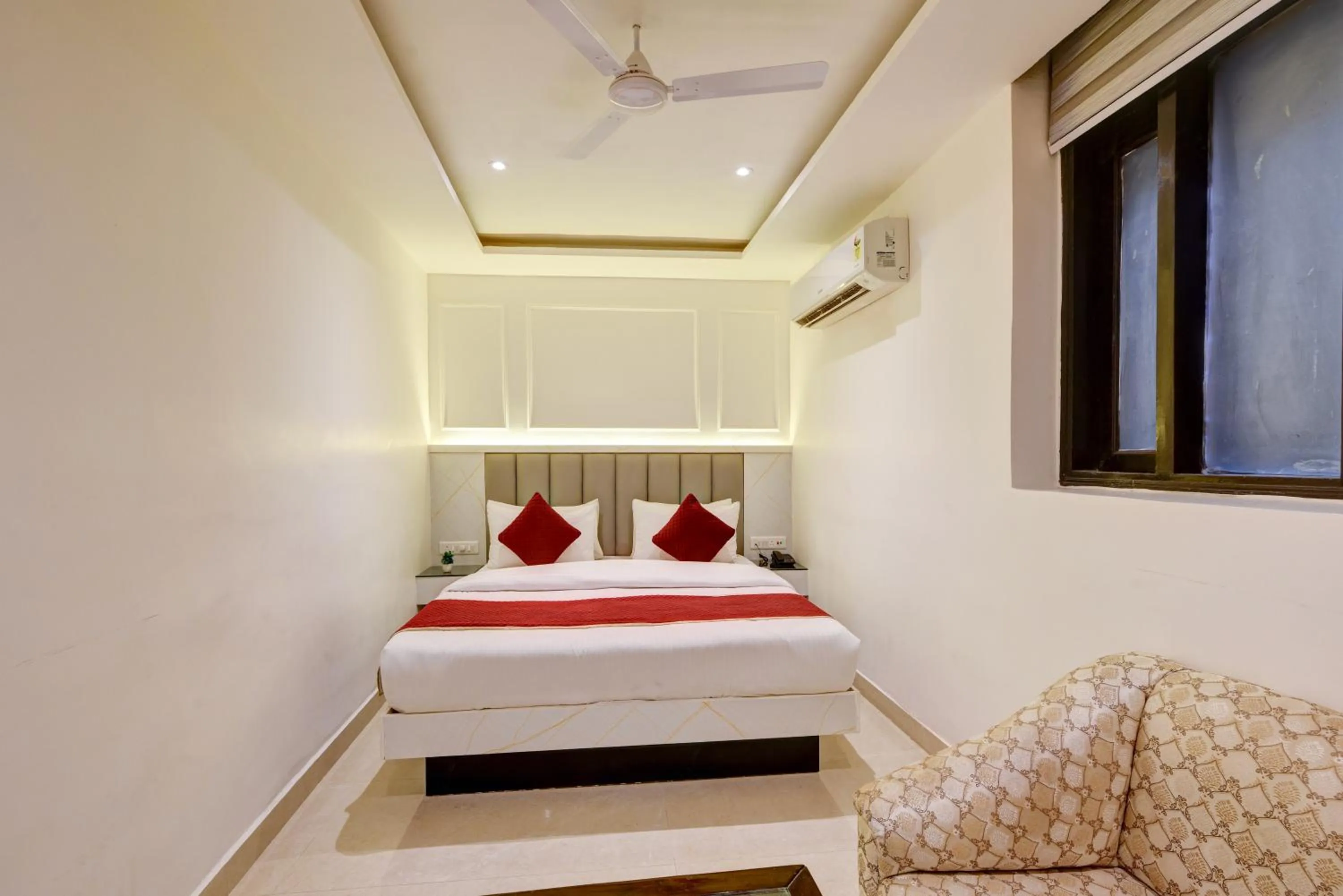 Seating area, Bed in Hotel Krishna Deluxe-By RCG Hotels