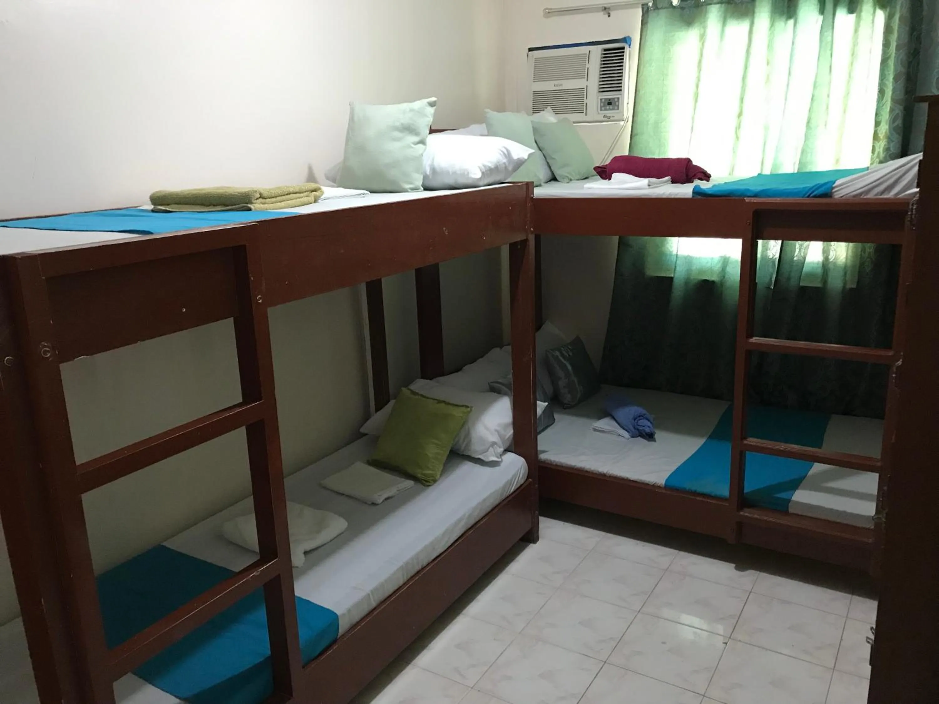 Photo of the whole room, Bed in Wendy's Apartelle