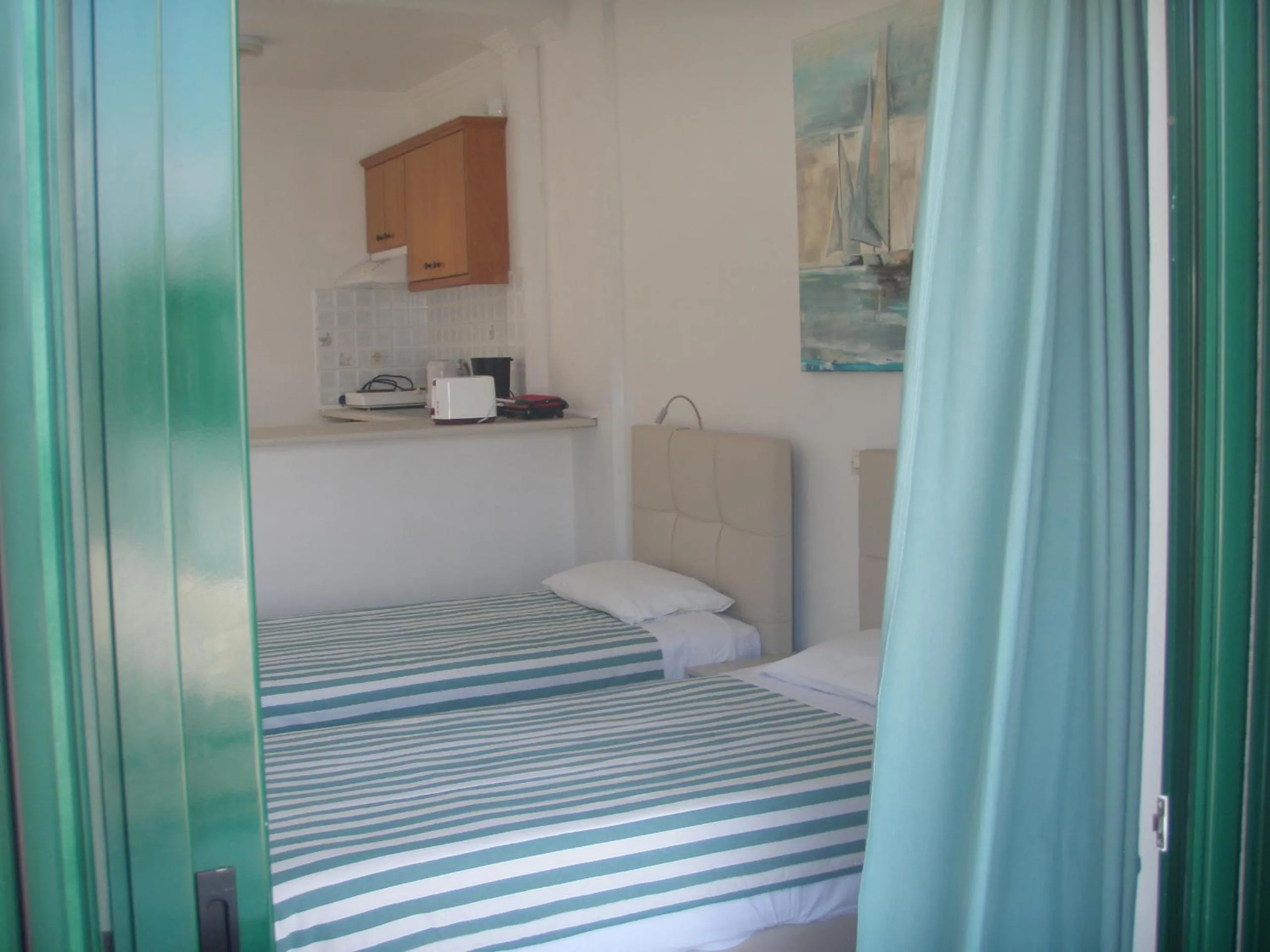 Bedroom, Bed in UMBRELLA BEACH APARTMENTs