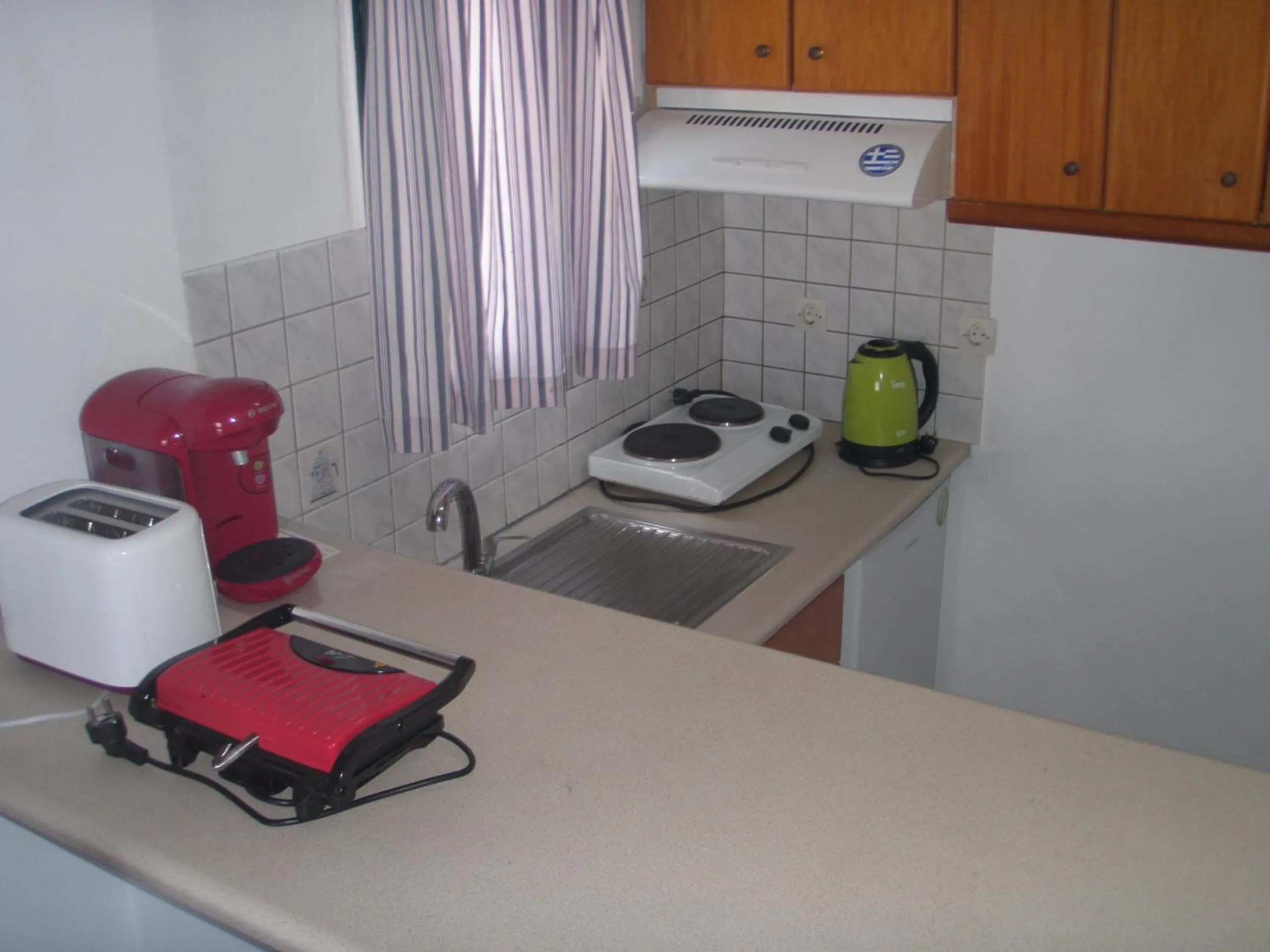 Kitchen or kitchenette in UMBRELLA BEACH APARTMENTs