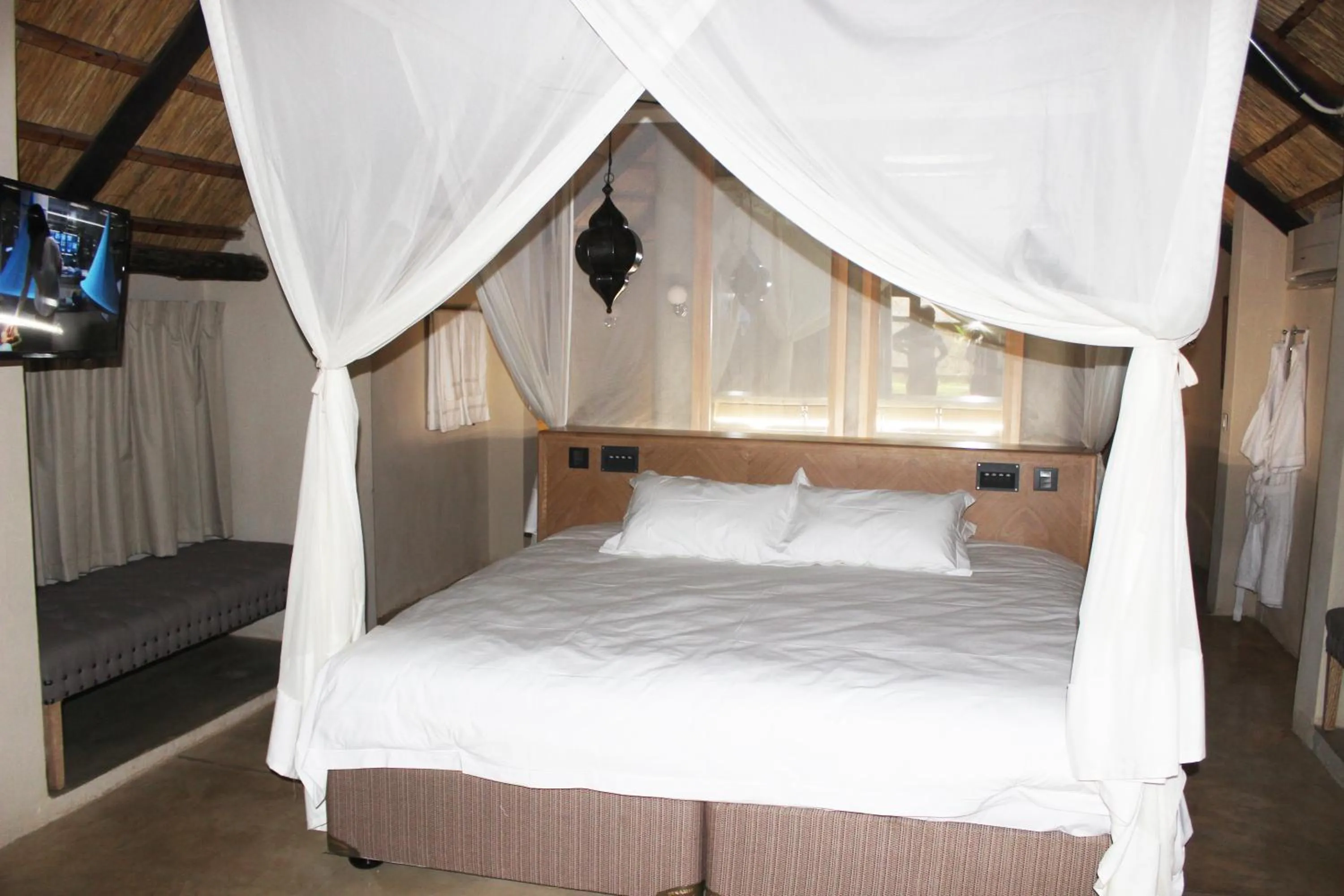 Photo of the whole room, Bed in The Royal Sichango Village