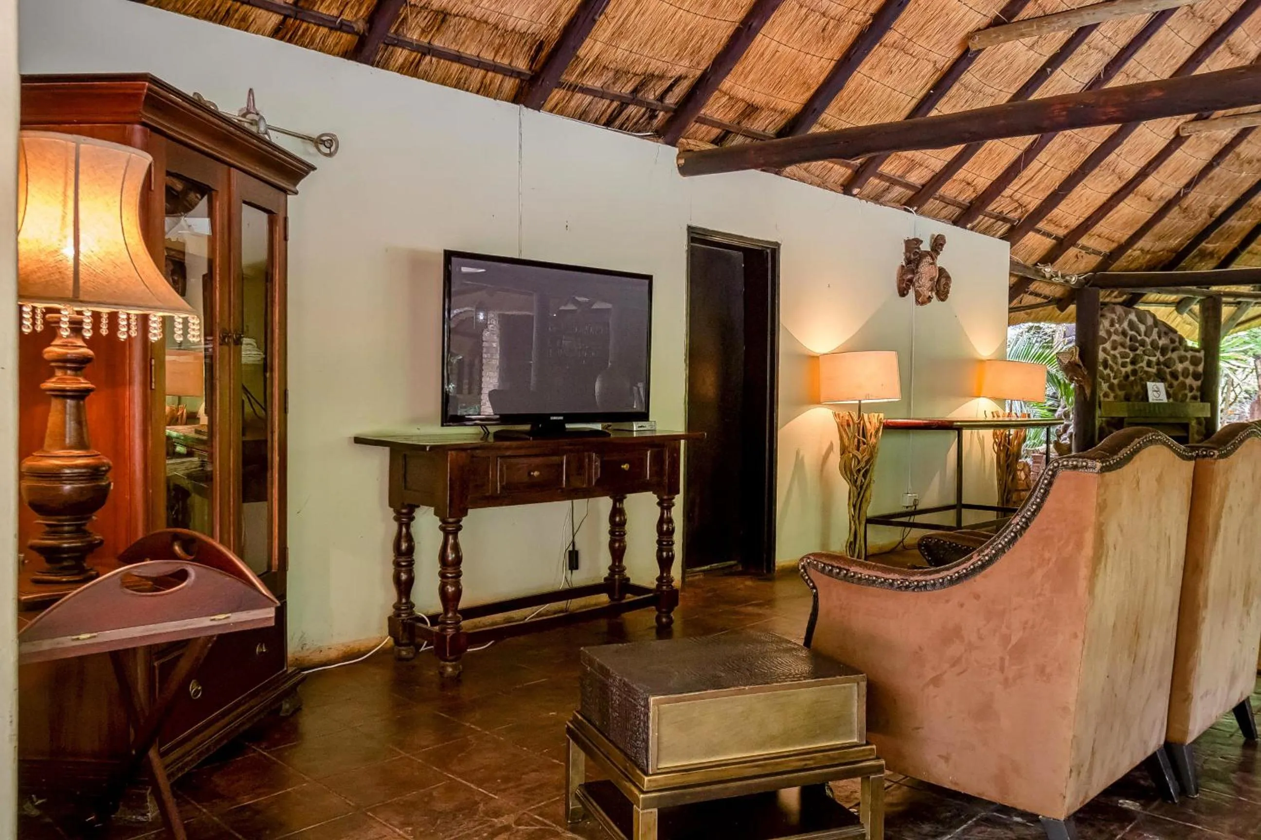 Communal lounge/ TV room in The Royal Sichango Village