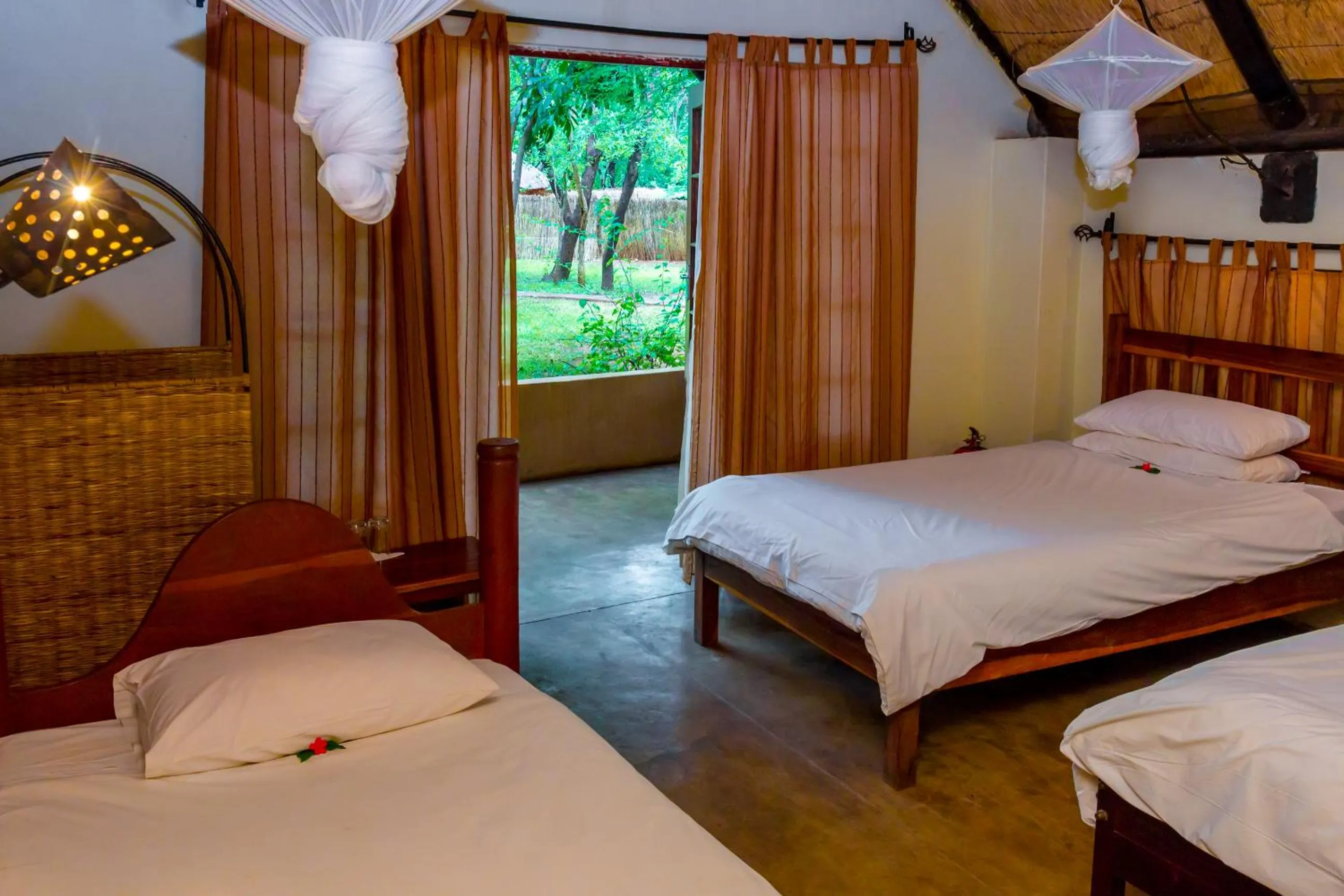Photo of the whole room, Bed in The Royal Sichango Village