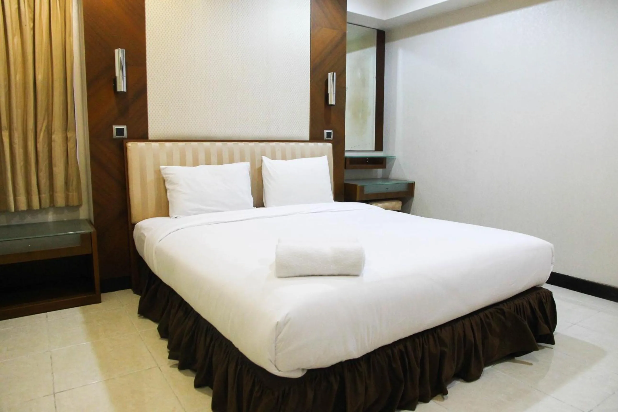 Bed in 2BR Family Sudirman Tower Condominium Apartment near Plaza Semanggi By Travelio