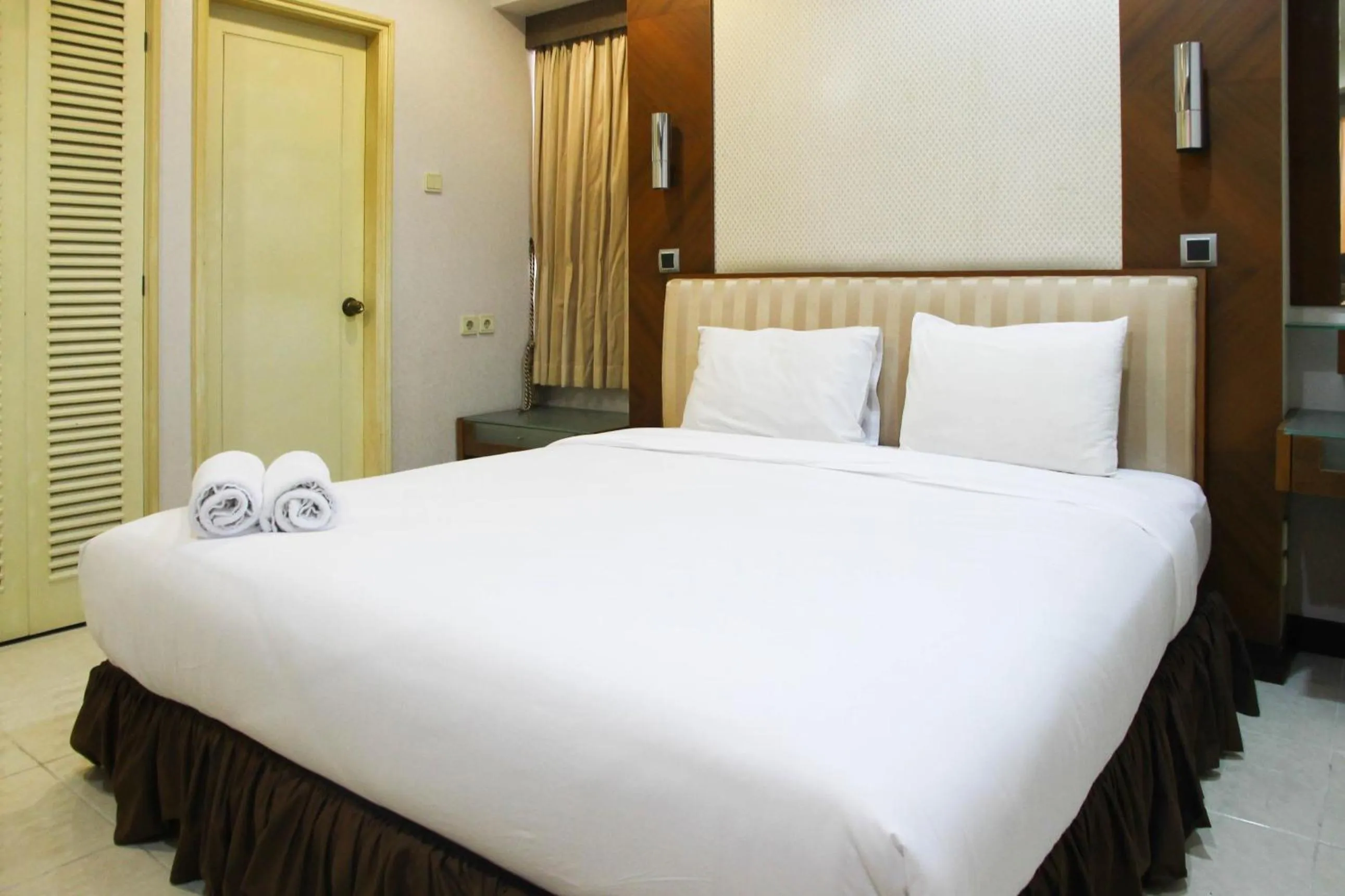 Bed in 2BR Family Sudirman Tower Condominium Apartment near Plaza Semanggi By Travelio