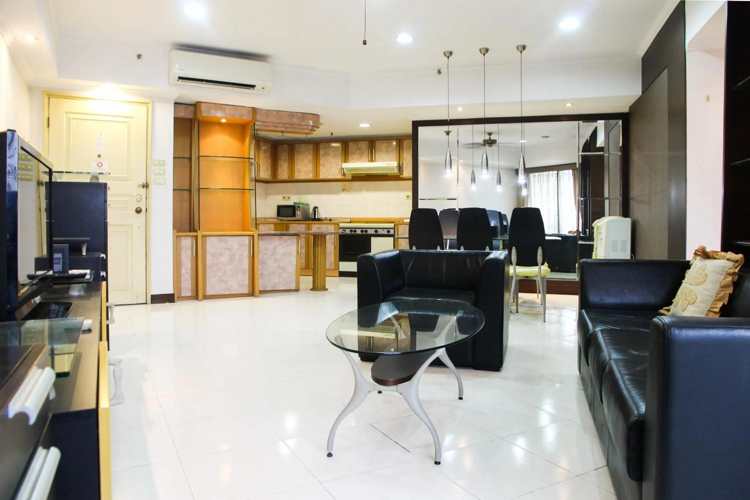 2BR Family Sudirman Tower Condominium Apartment near Plaza Semanggi By Travelio