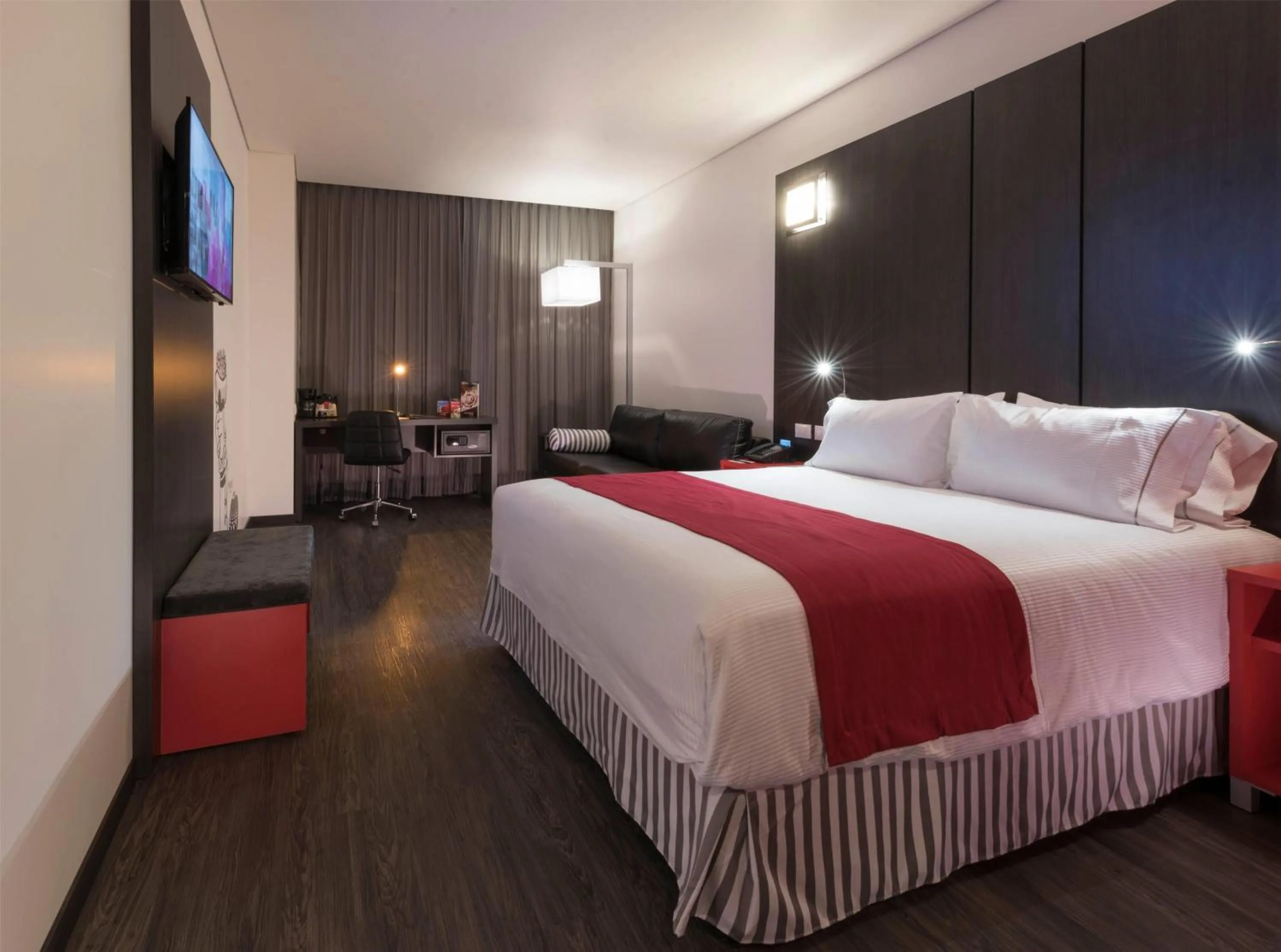 Photo of the whole room, Bed in Ramada Encore by Wyndham Guadalajara Sur