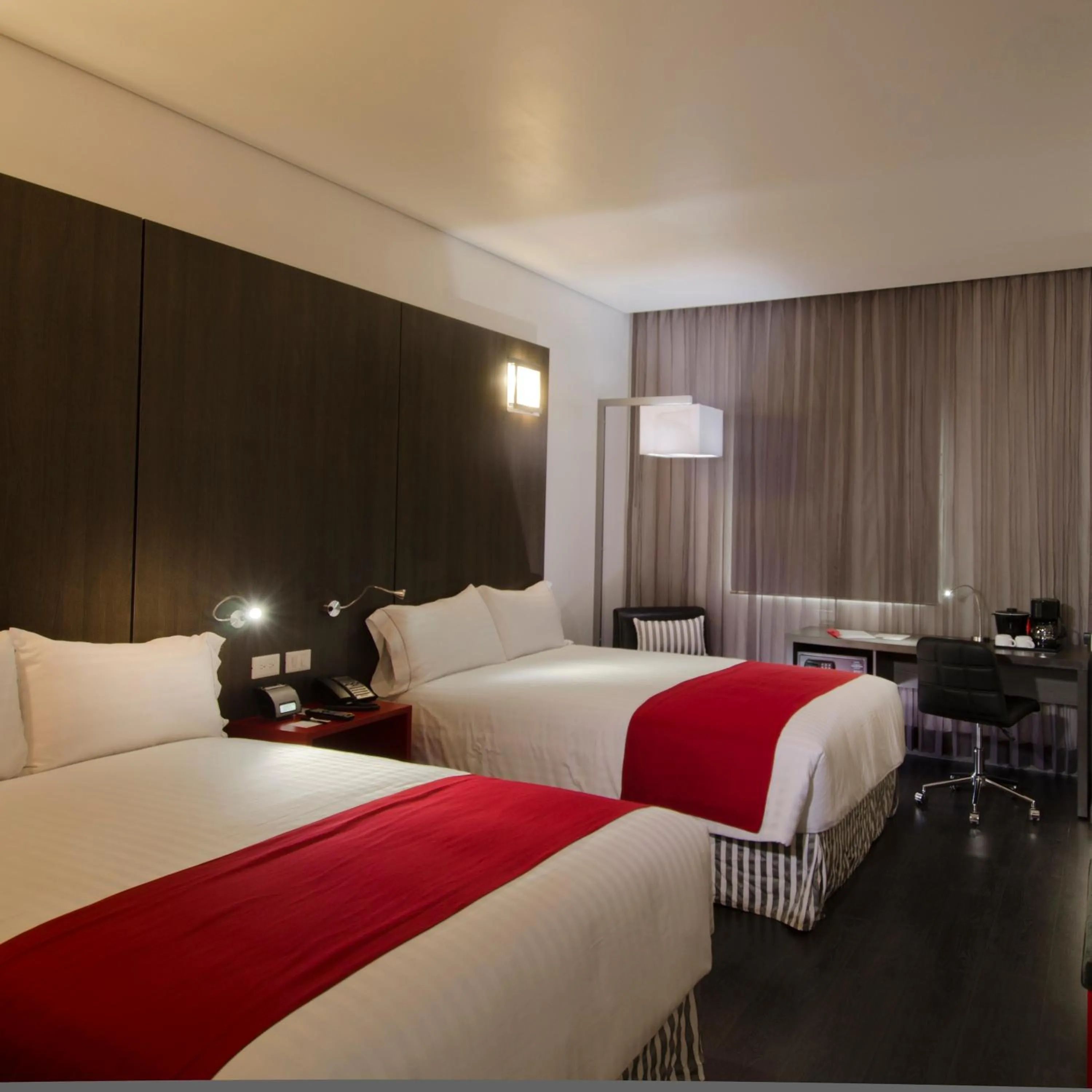 Bed in Ramada Encore by Wyndham Guadalajara Sur