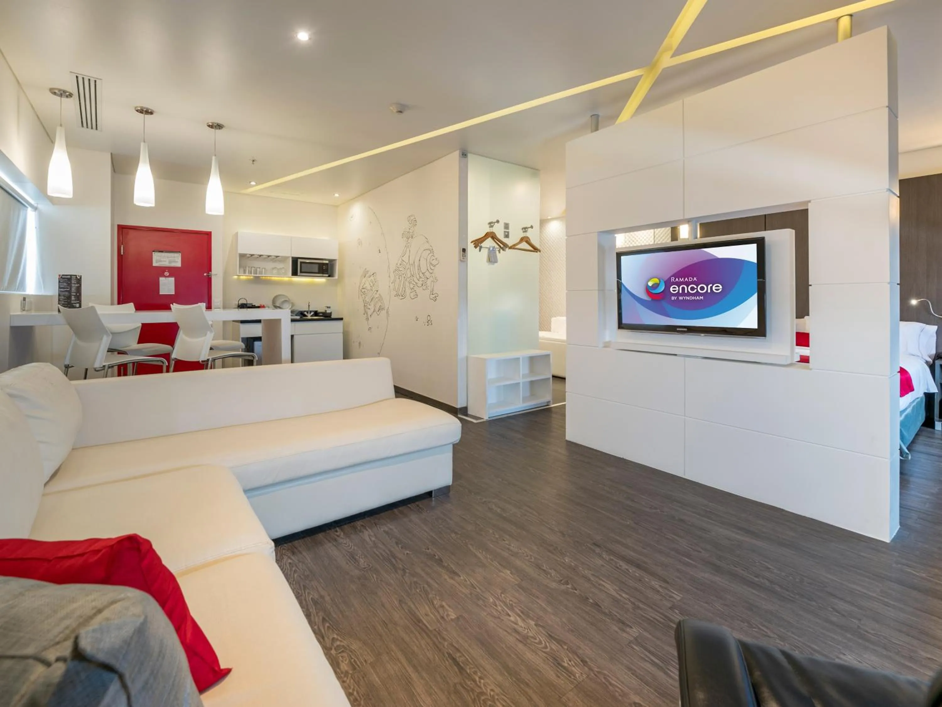 Living room, Bed in Ramada Encore by Wyndham Guadalajara Sur