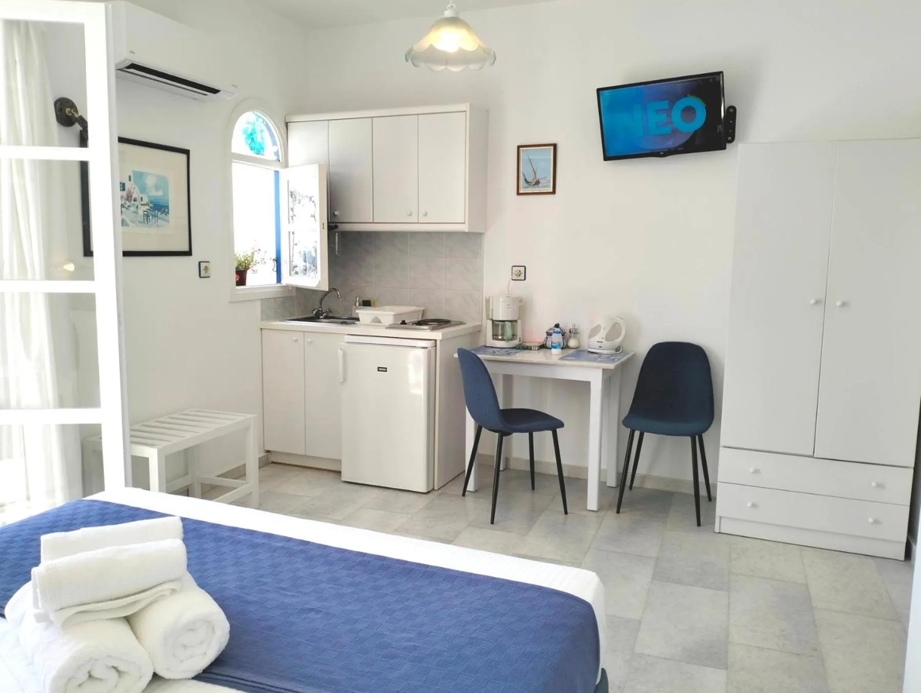 Kitchen or kitchenette in Nostos Studios at Saint George beach Agios Georgios Chora Naxos town