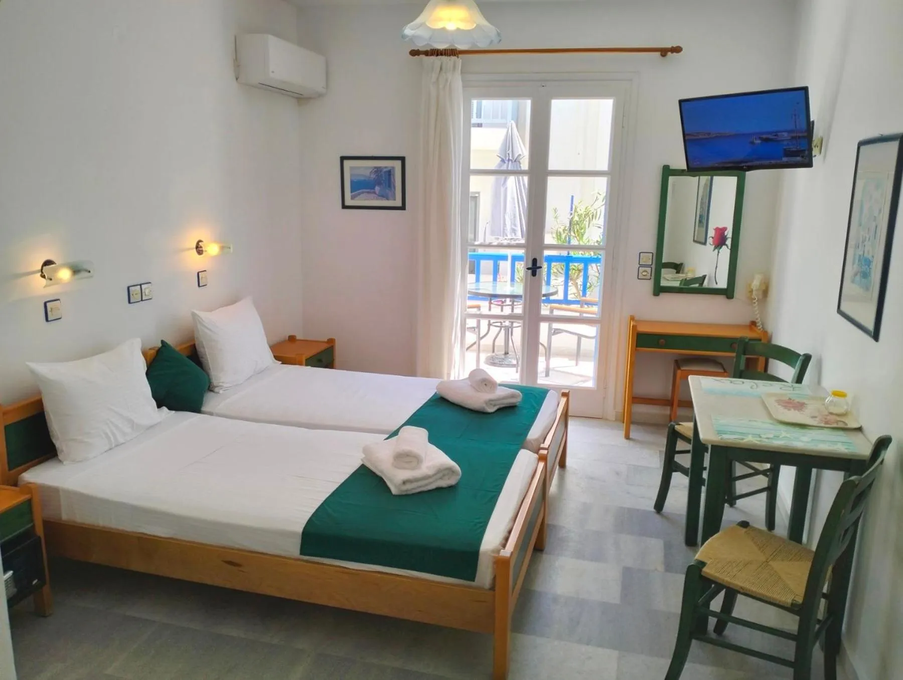 TV and multimedia, Bed in Nostos Studios at Saint George beach Agios Georgios Chora Naxos town